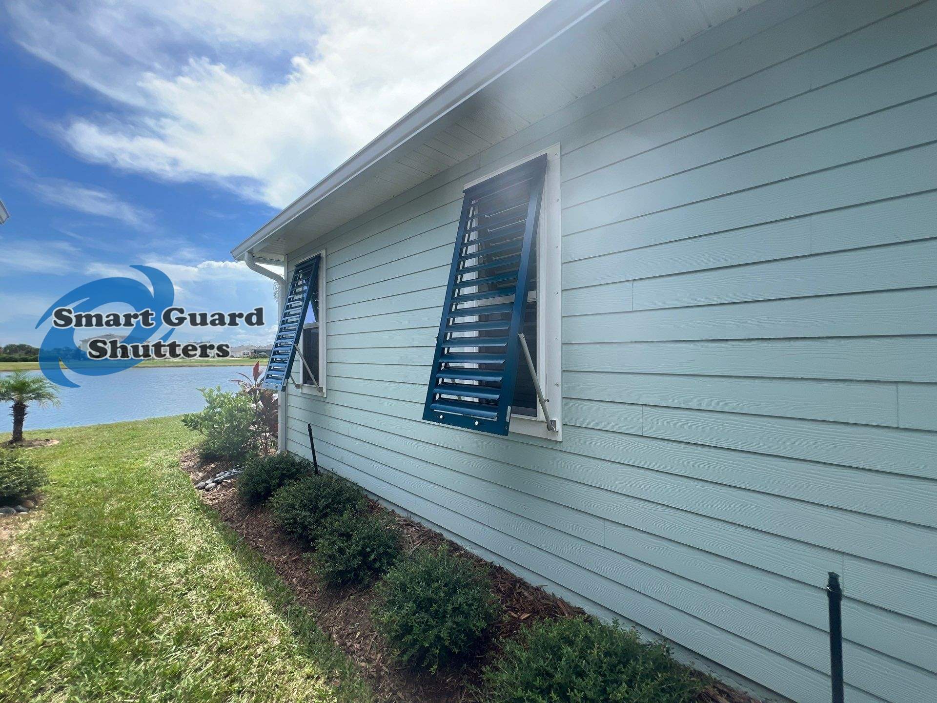 Impact Bahama Shutters in Ocean Blue by Smart Guard Shutters