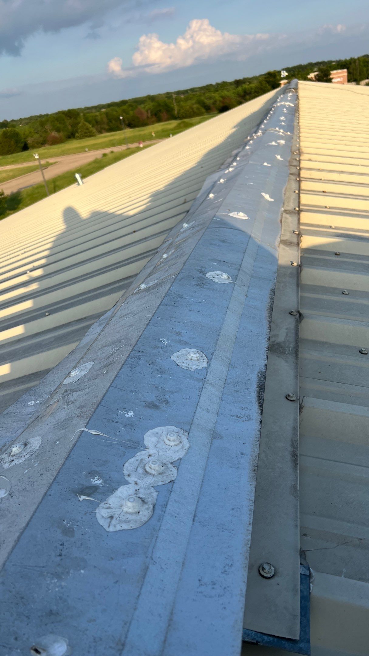 Drainage System Installation and Metal Roof Repairs by Harvey Roofing & Construction