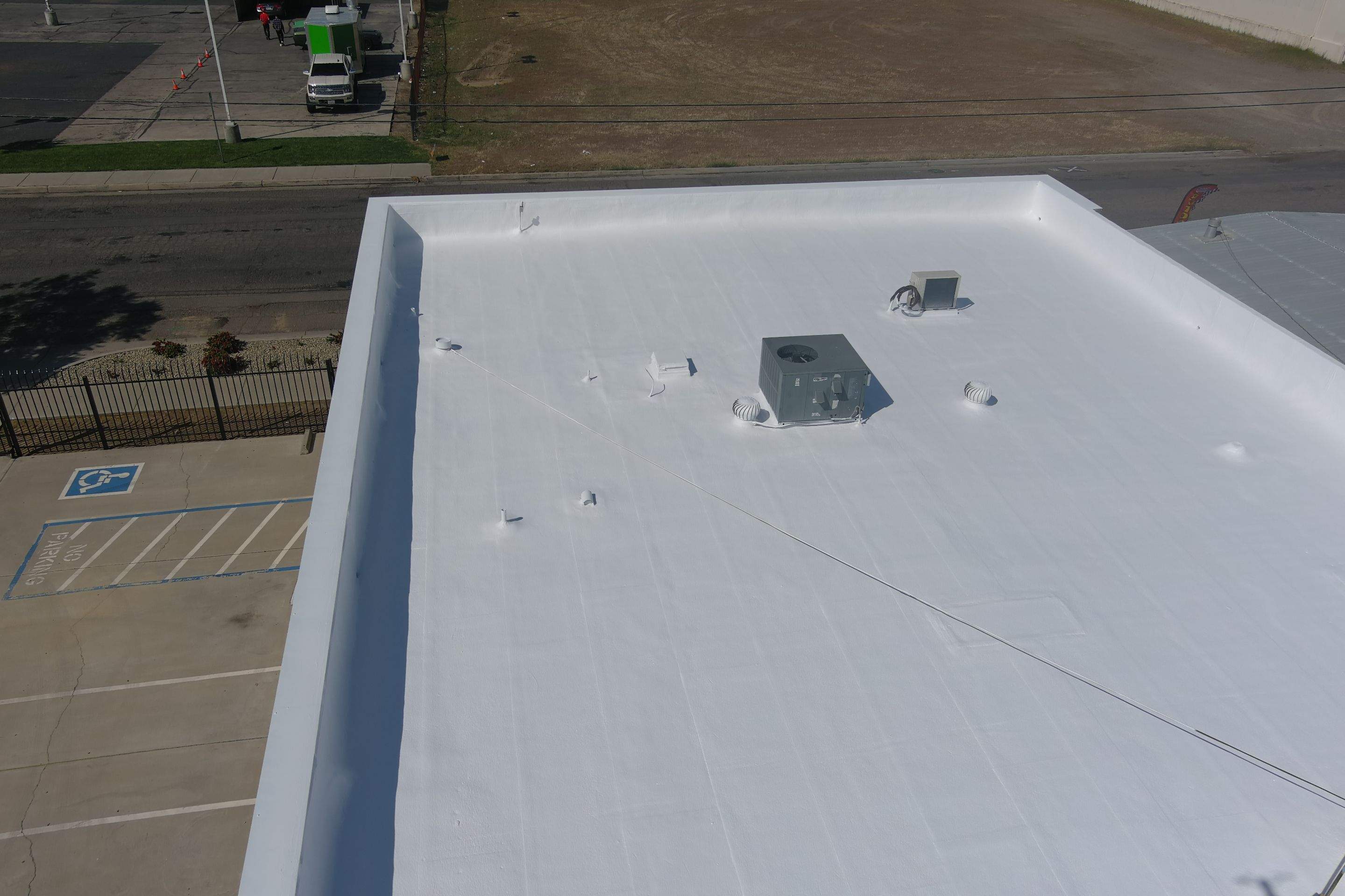 Spray foam and coatings using Conklin Benchmark/PUMA XL coatings and spray foam by Straight Edge Roofing Inc