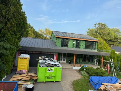 Residential Roofing Installation using 16" Standing Seam Panels