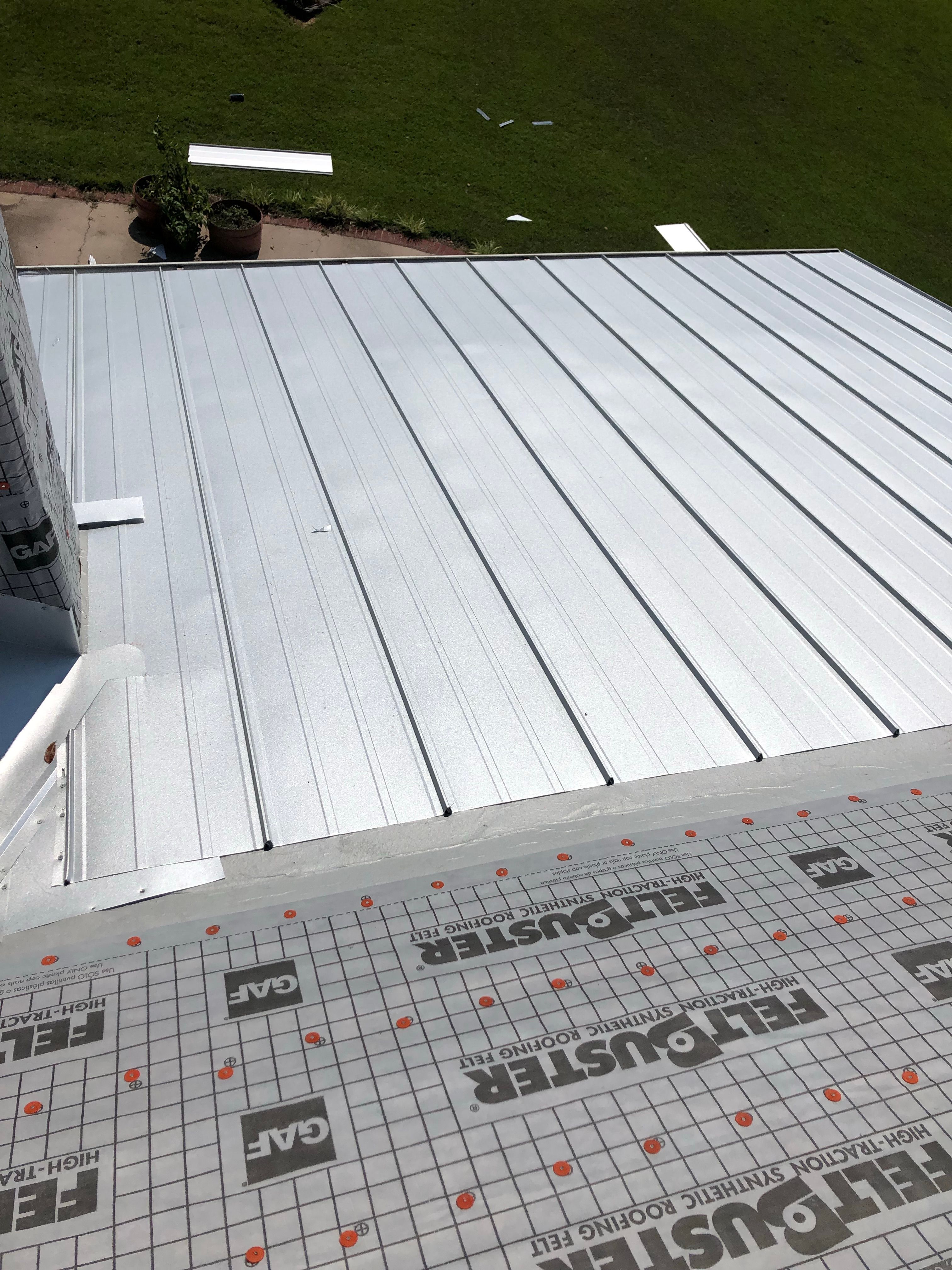 Residential Roofing Installation using Metal roofing by American Roofing & Construction LLC