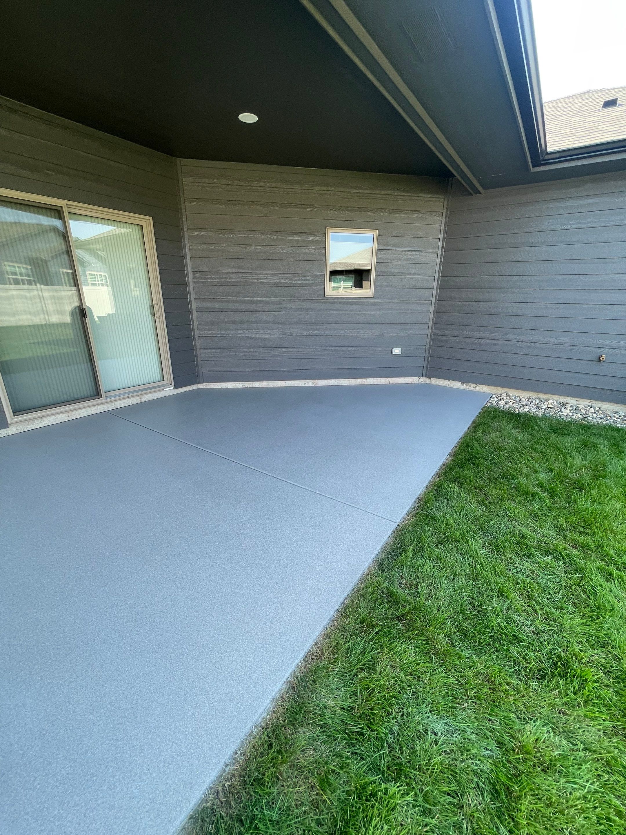 Sioux Falls Residential Concrete Patio and Walkway Coating by Select Painting, Coatings & Garage Cabinets