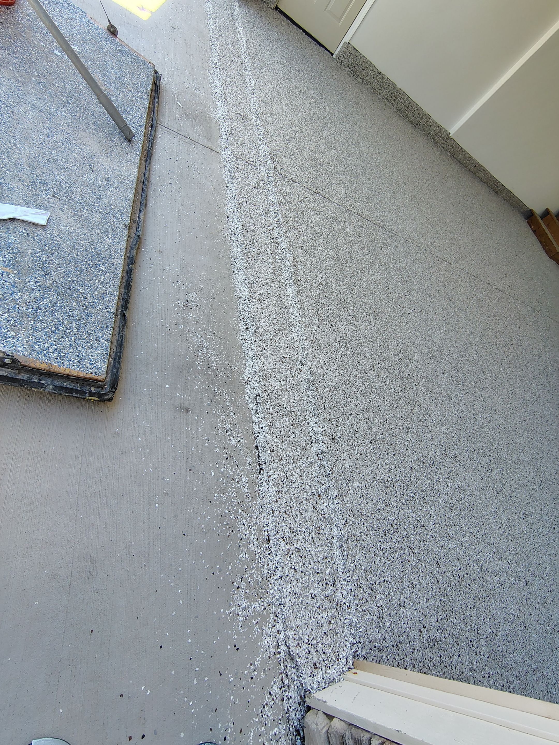Custom Grey Speckled Epoxy Floor Coating for Sioux Falls Garage by Select Painting, Coatings & Garage Cabinets