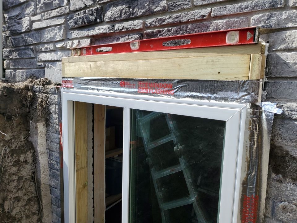 Egress Window Installation using Rockwell Egress Fiberglass Egress Window Well by Toledo Basement Repair 