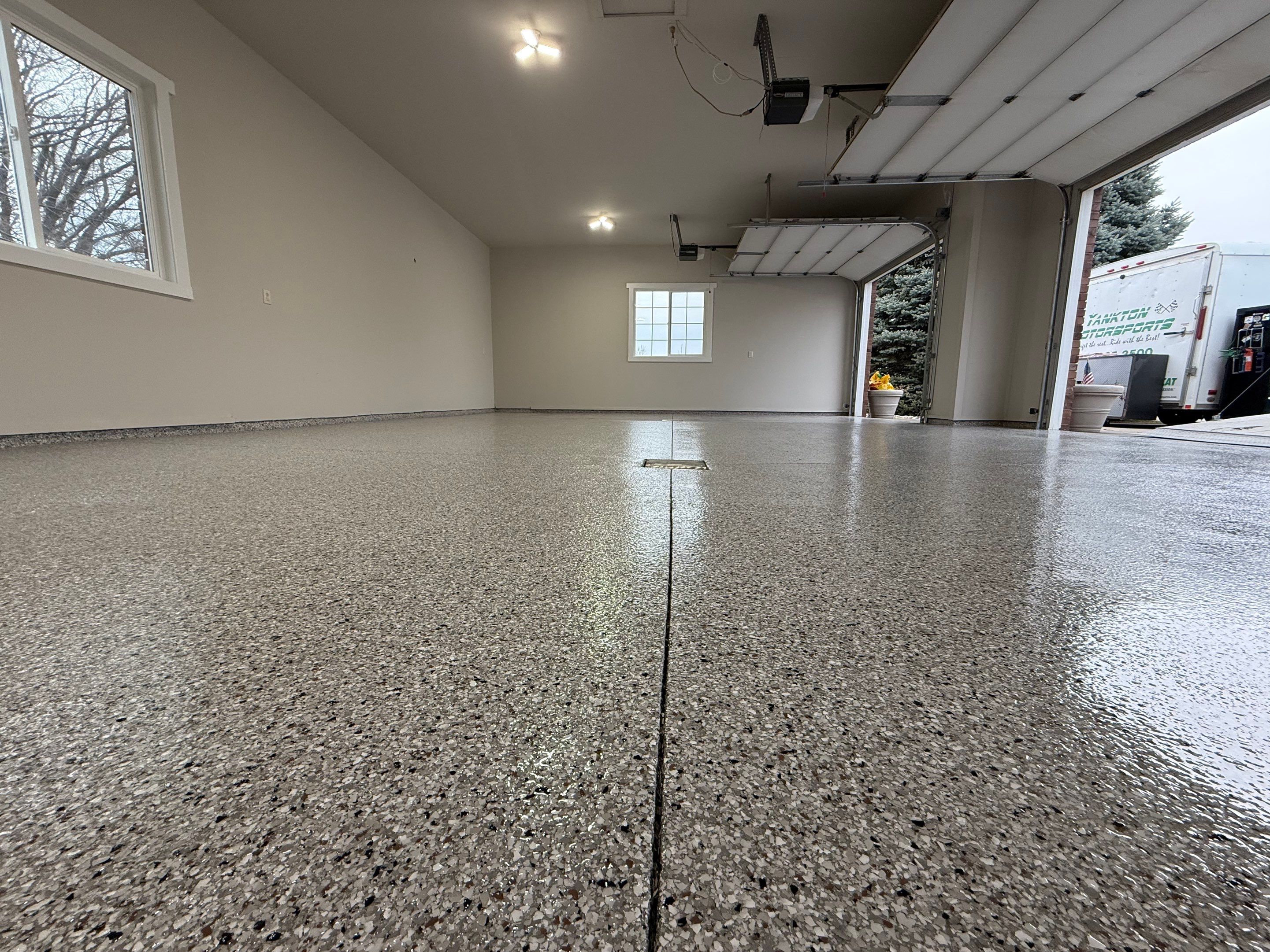 Garage transformation in Yankton by Select Painting, Coatings & Garage Cabinets