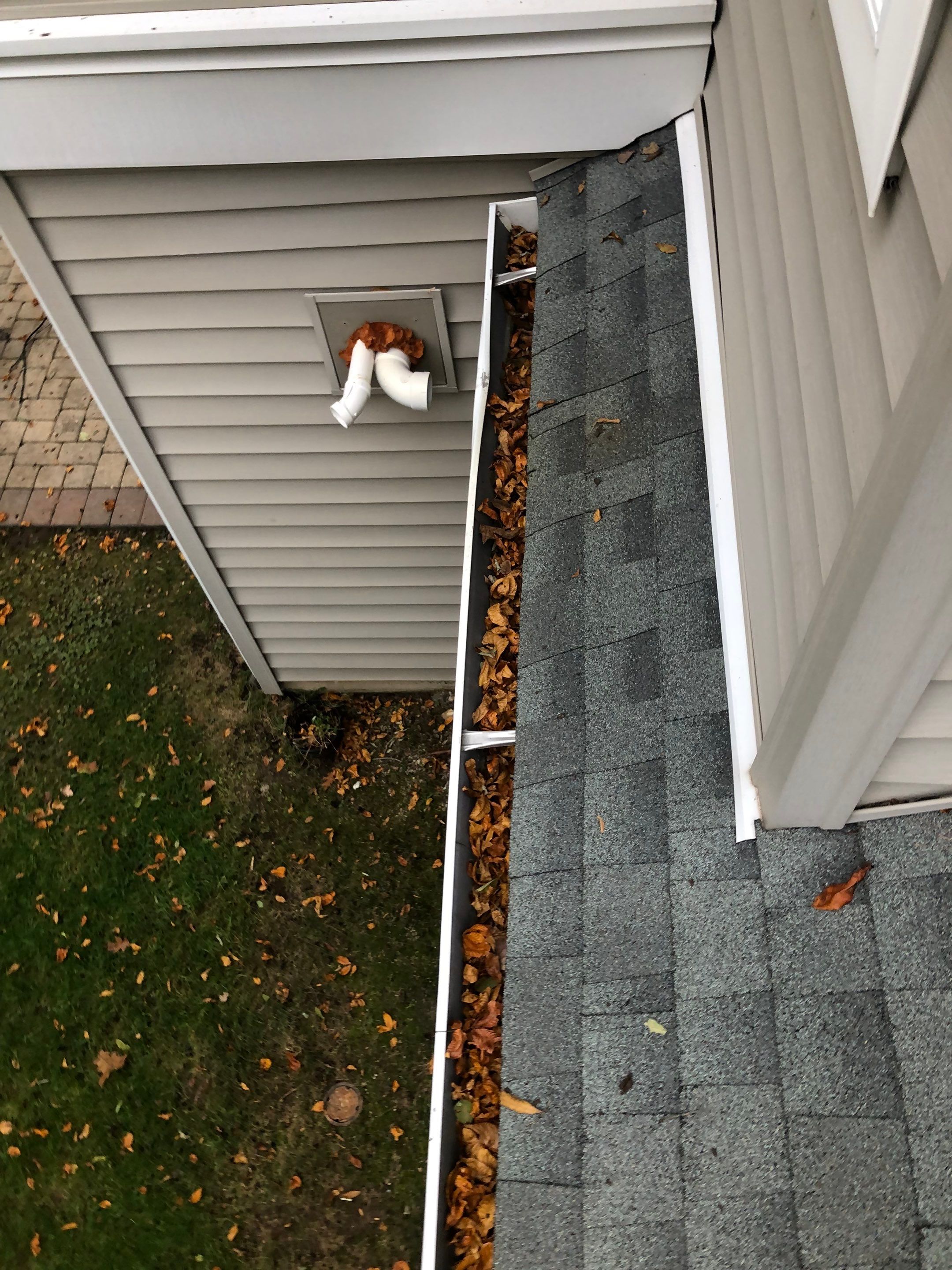 Commercial gutter cleaning Stamford & Norwalk before photo with filled gutters