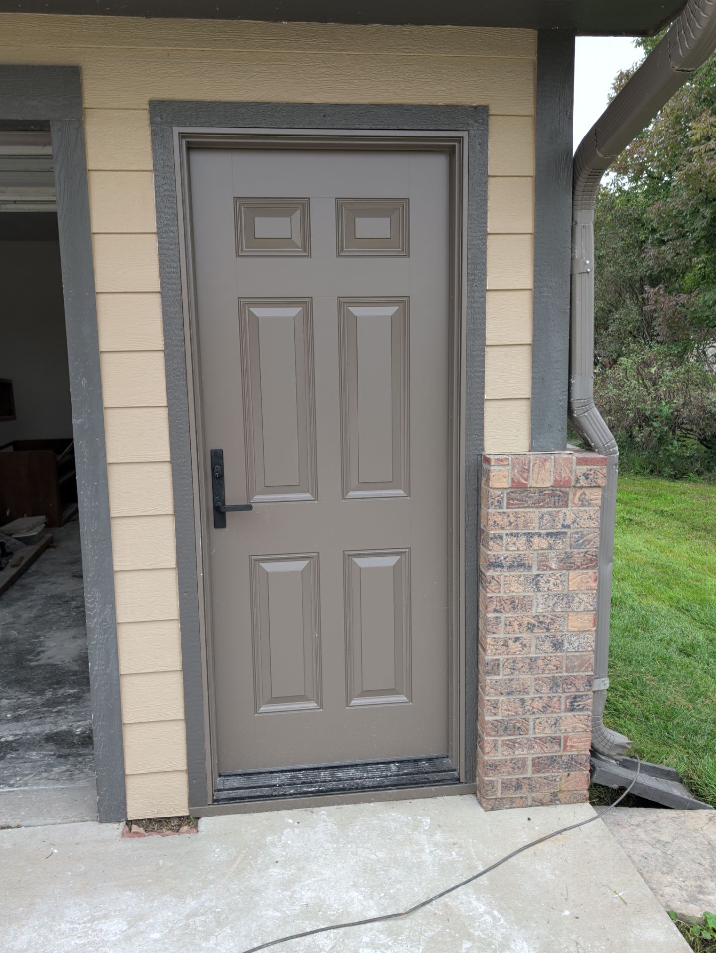 Yankton Garage Remodel with Andersen Window Installation and Drywall by Select Painting, Coatings & Garage Cabinets
