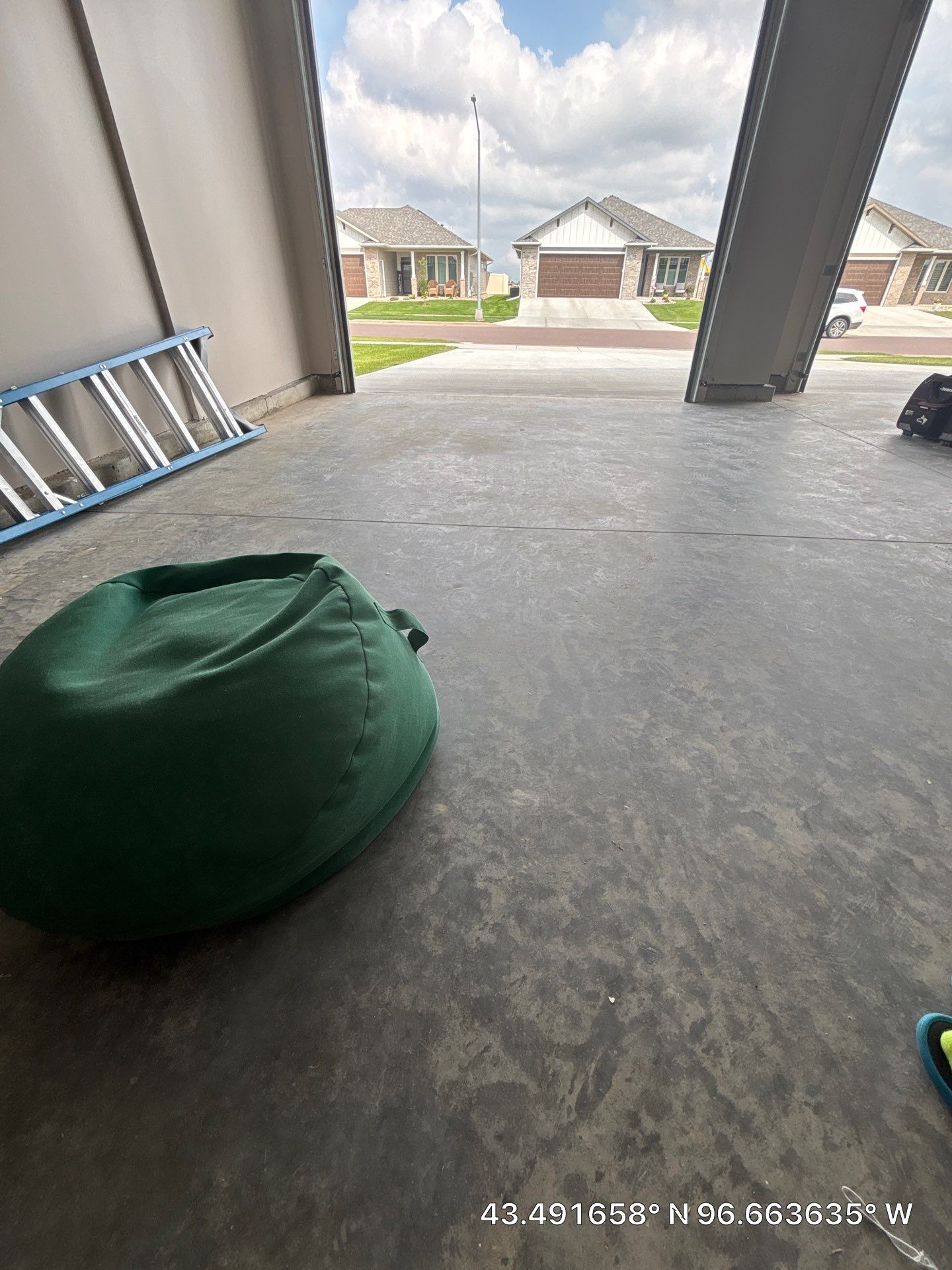Full Speckled Concrete Coating for Sioux Falls Garage by Select Painting, Coatings & Garage Cabinets