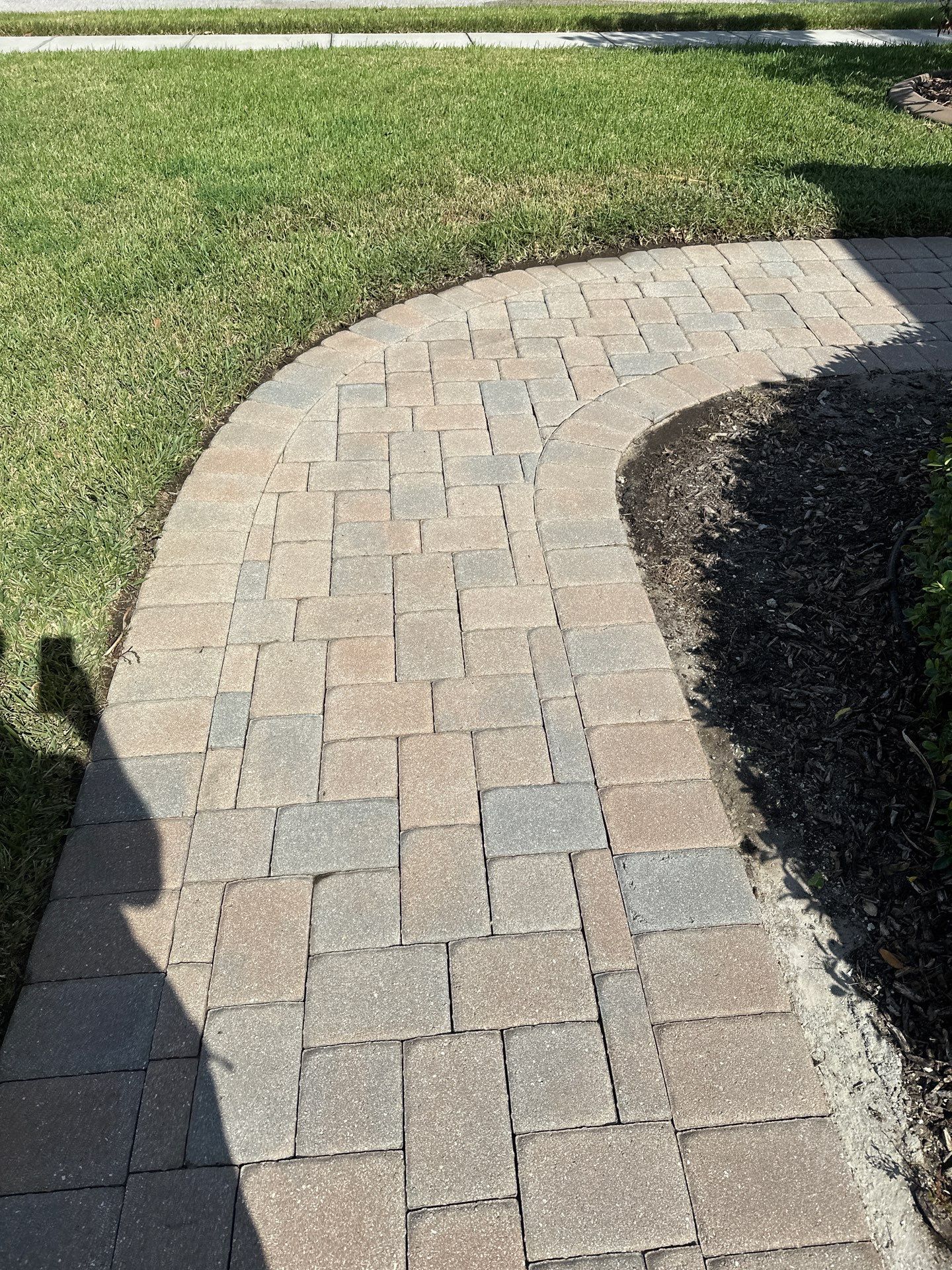 Paver Driveway, Entryway, Sidewalk, and Street Curbing Cleaning in Winding River Community, Bradenton, FL by Sunshine AquaWash