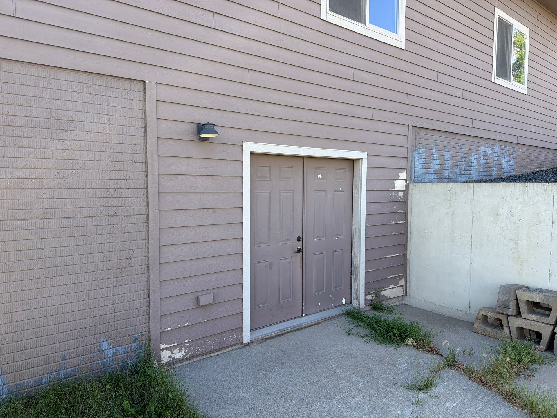 Full Exterior Siding Paint Restoration and Refresh in Garretson by Select Painting, Coatings & Garage Cabinets