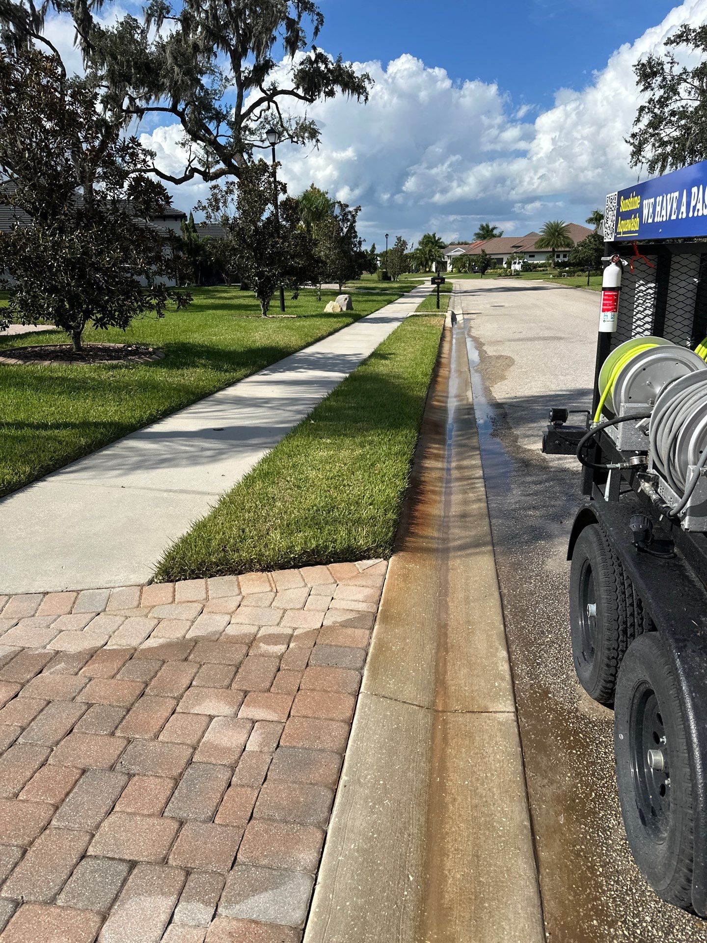 Paver Driveway, Entryway, Sidewalk, and Street Curbing Cleaning in Winding River Community, Bradenton, FL by Sunshine AquaWash