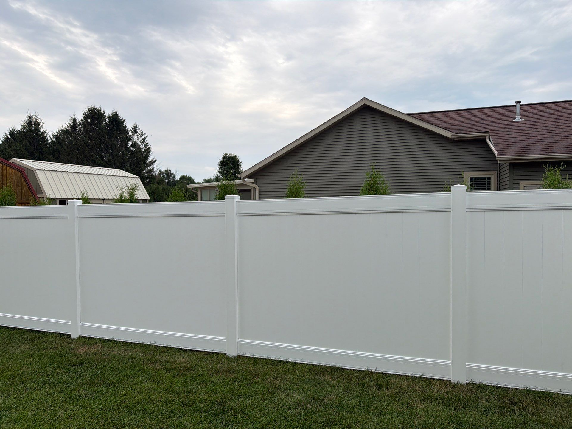 White Vinyl Privacy Fence and Double Gate Installation in Jesup by Perfect Picket Fence and Stain