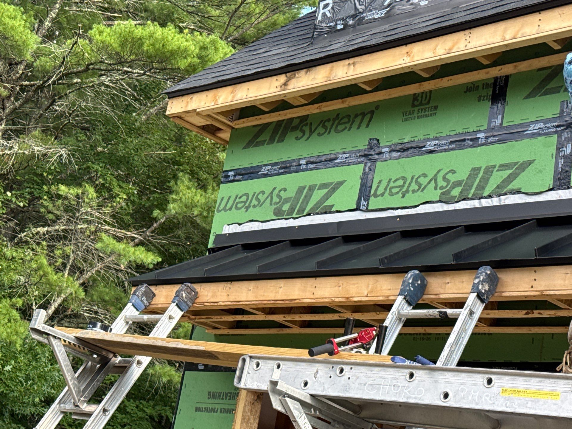 Merrimack NH ADU Roof Installation with Owens Corning Onyx Black Shingles and Standing Seam Metal Accents by Compass exteriors