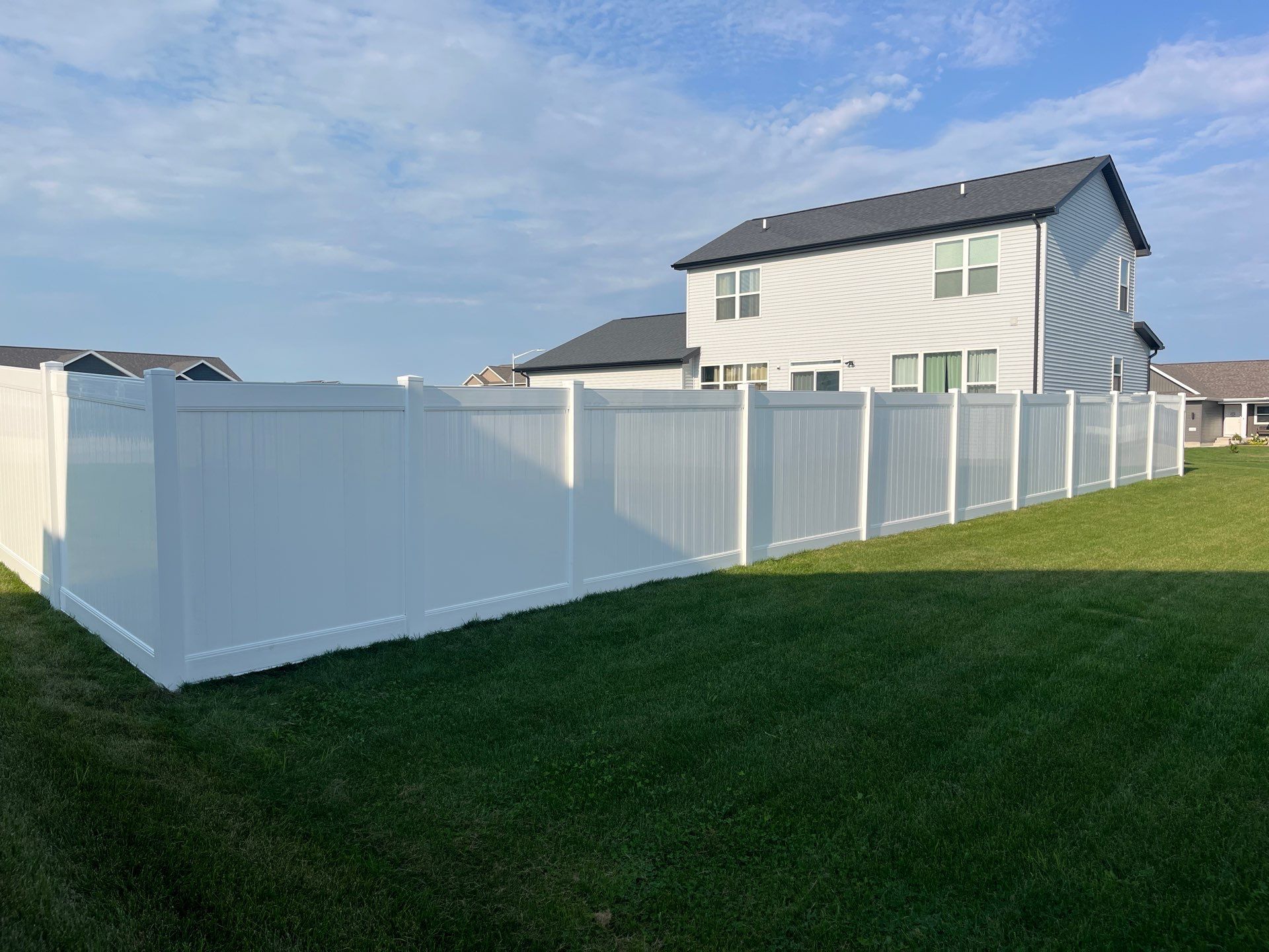 White Vinyl Privacy Fence Installation With Double Gates in Waterloo by Perfect Picket Fence and Stain