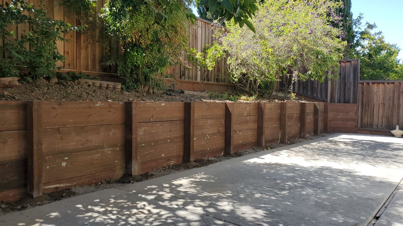 Board on Board & 3' high retaining wall by Fremont Fence Inc