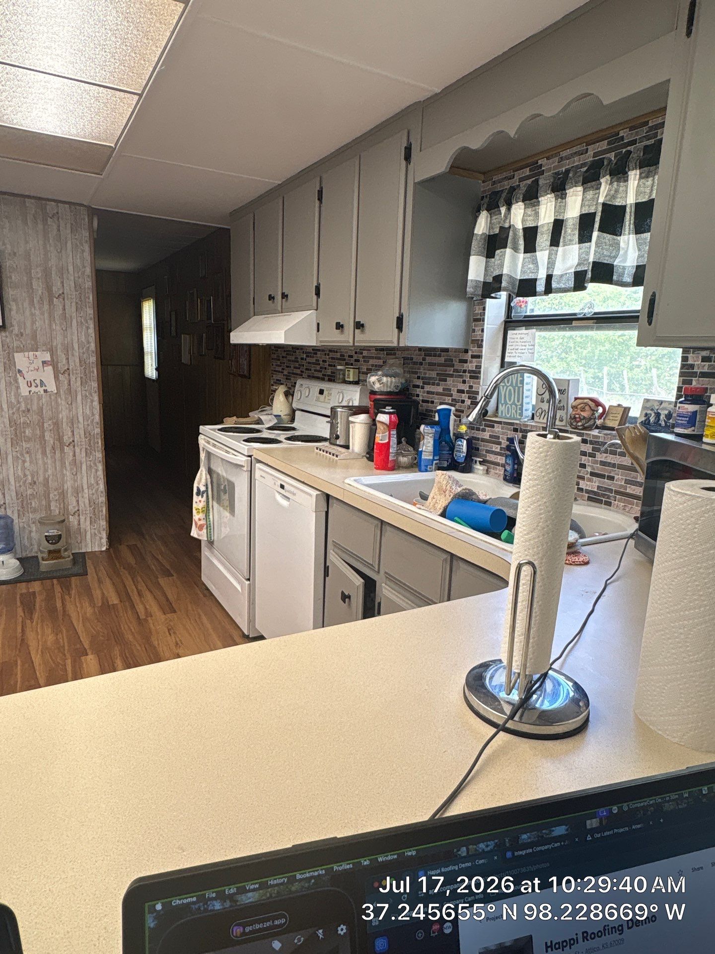 Attica Kitchen Remodel Featuring Gray Cabinets and Glass Tile Backsplash by CompanyCam Sales Demo