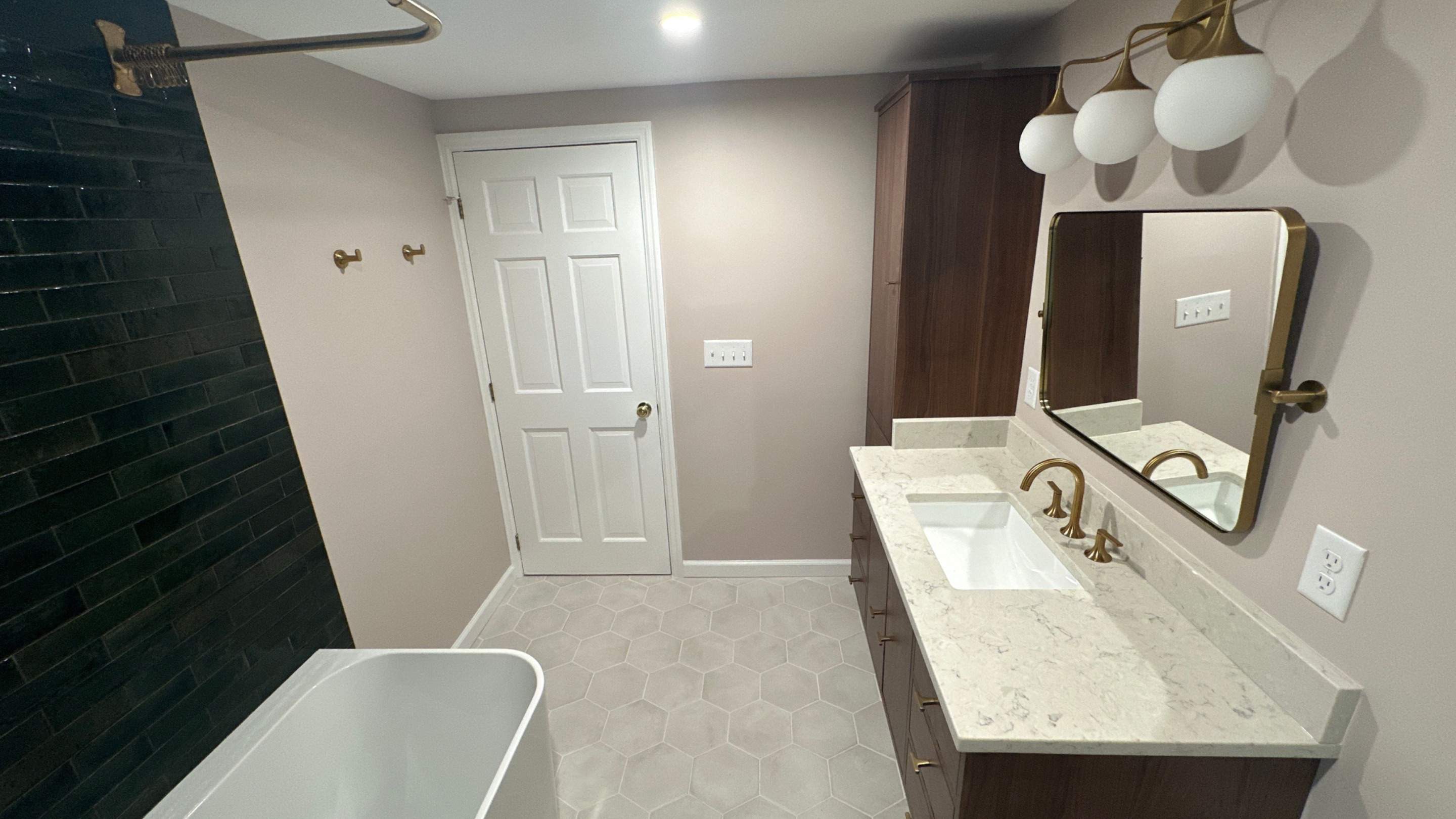 Brandt Double Bathroom Remodels by Integrity Tile and Home LLC