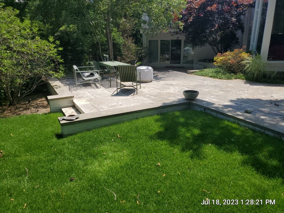 marble patio cleaning and sanding using Polysweep polymeric sand by Northern Power Washing LLC.