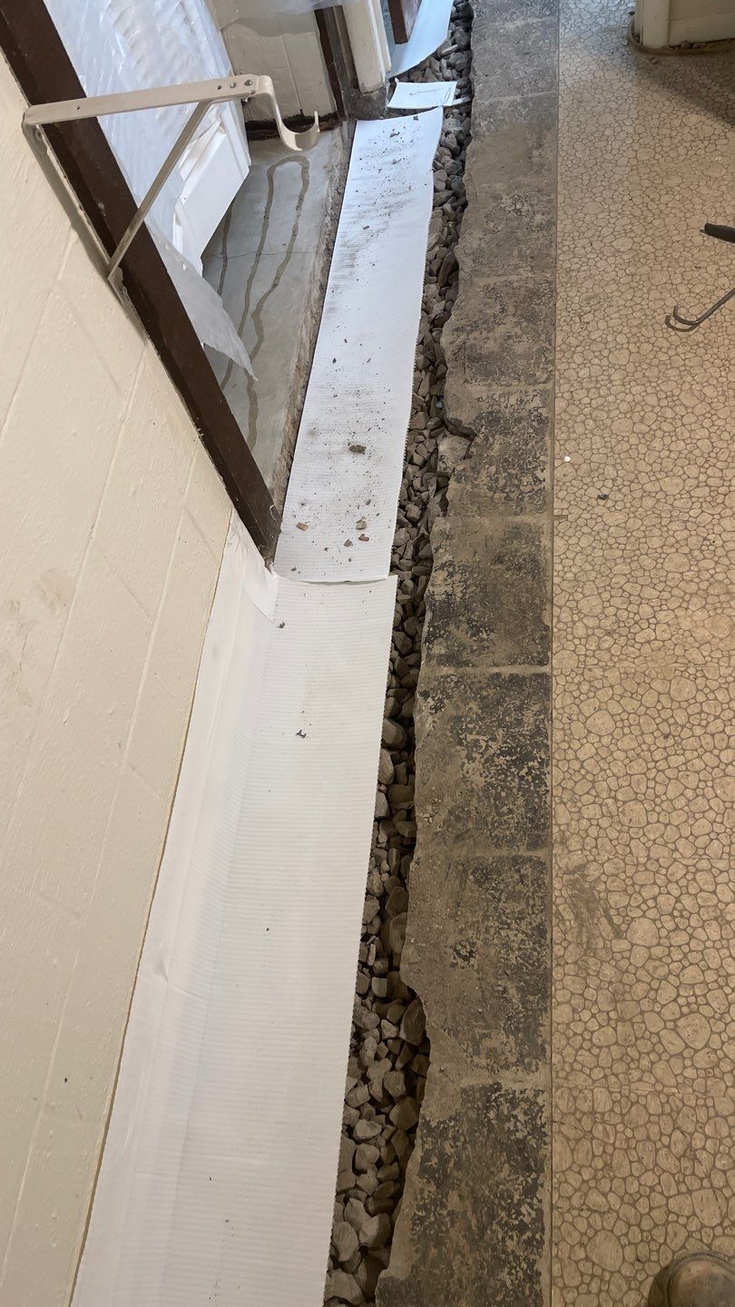 Interior Waterproofing Using GrateDrain™ Products by Toledo Basement Repair 