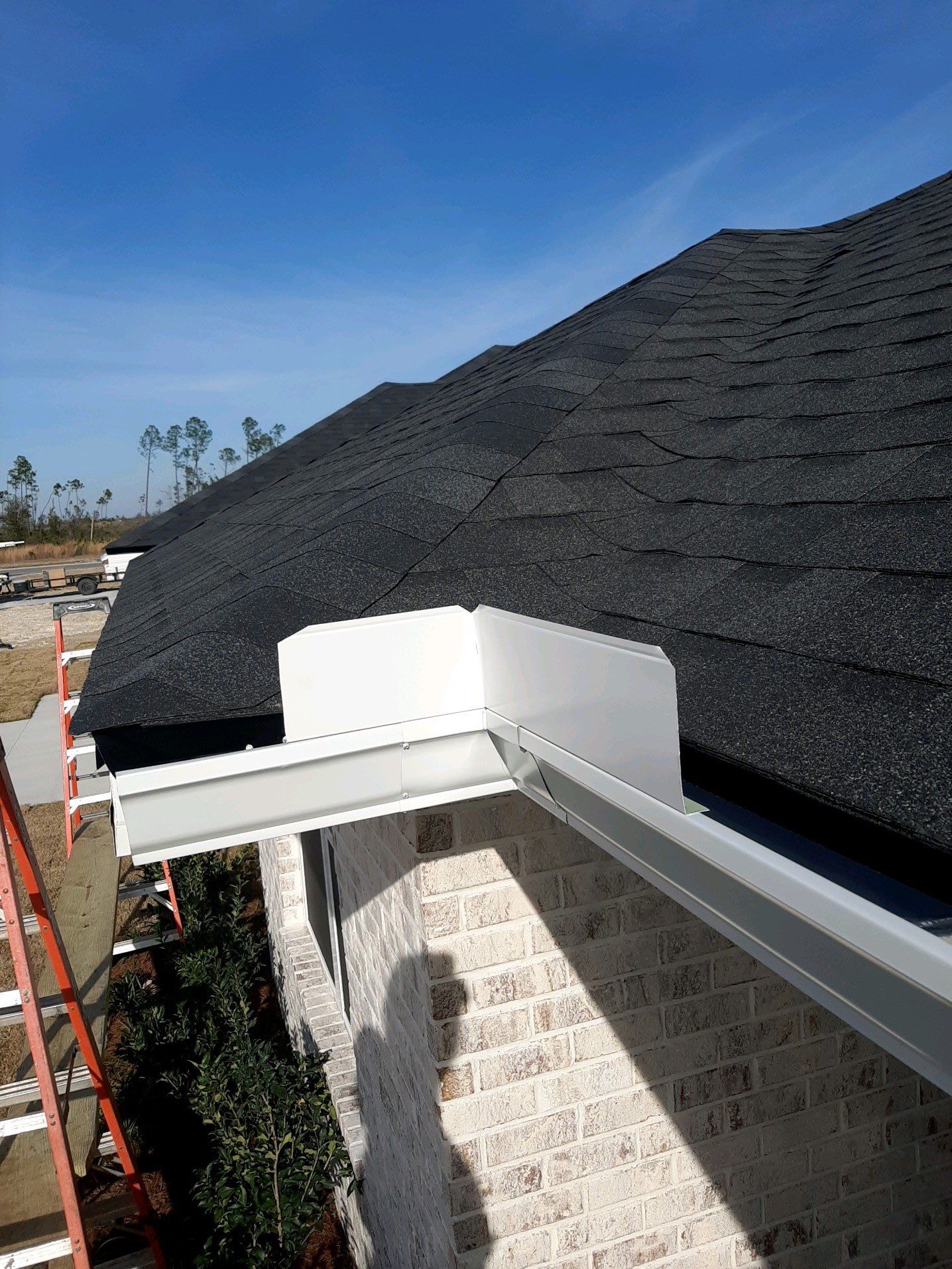Seamless Gutter Installation Using White K-Style Gutters by Gutter Professors