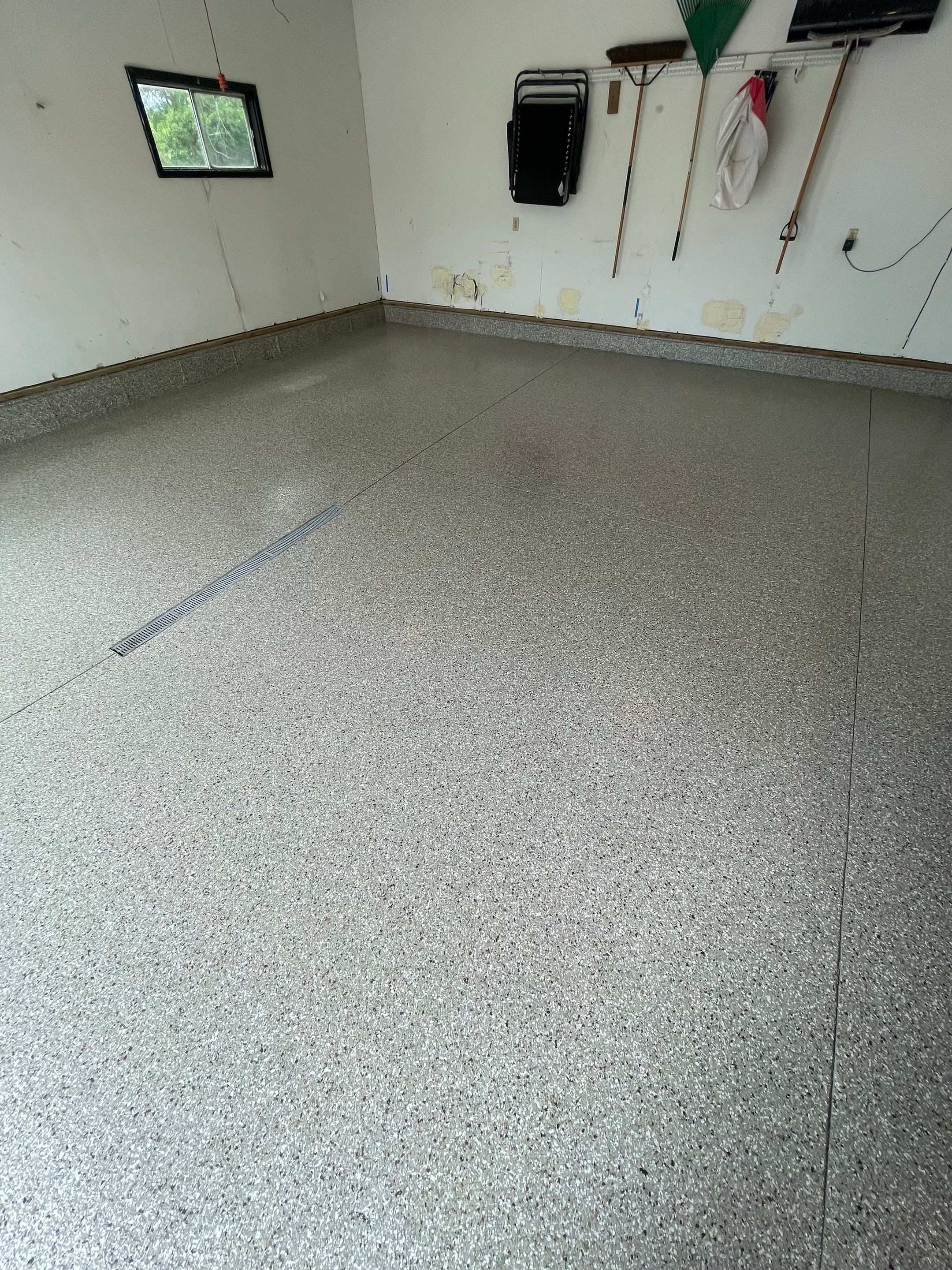 Hartford Residential Garage Floor Transformation With Decorative Chip Coating by Select Painting, Coatings & Garage Cabinets