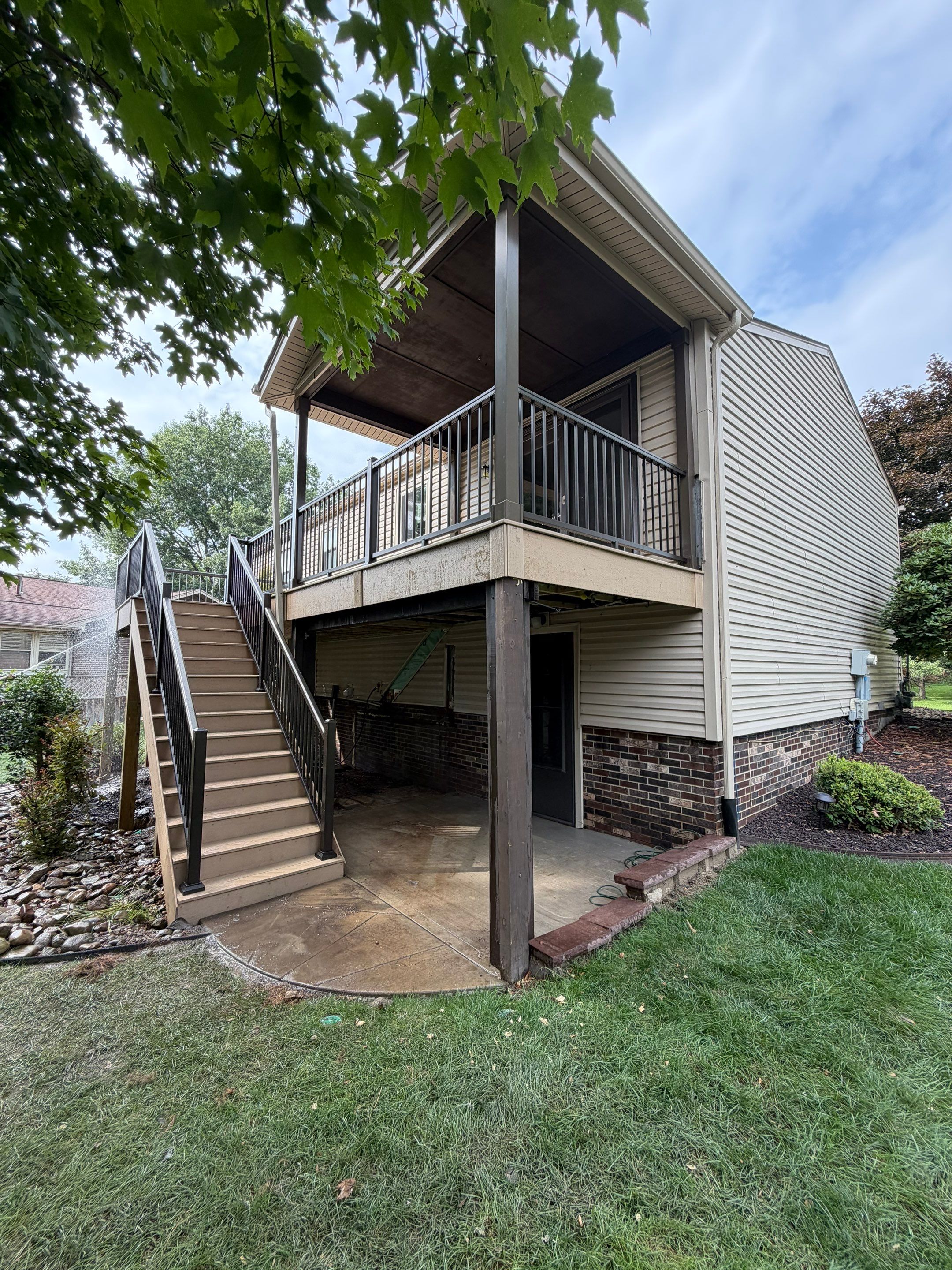 Elevated Composite Deck Installation with Covered Porch in South Park Township by Cousins Roofing Siding & Decks