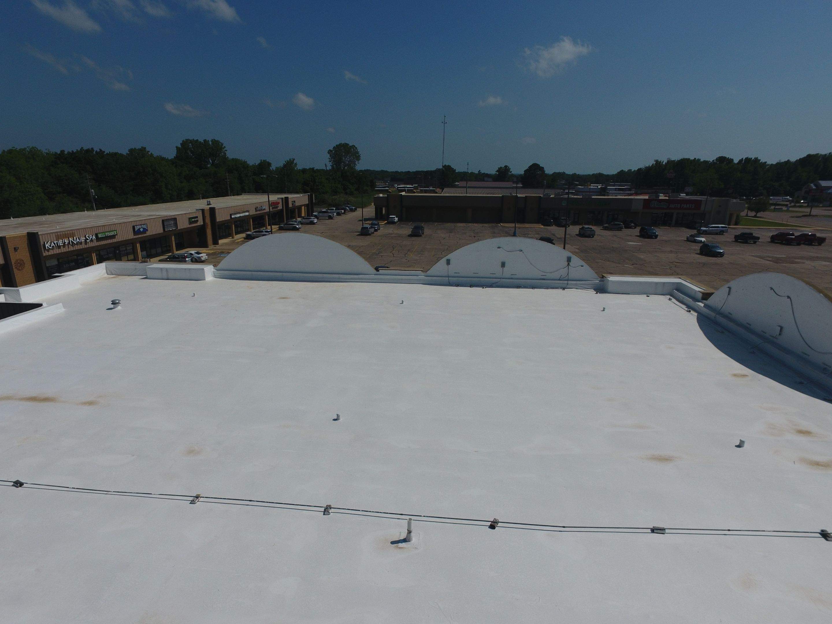 Commercial Roofing Installation using Aldocoat Coatings by Hostetler Roofing
