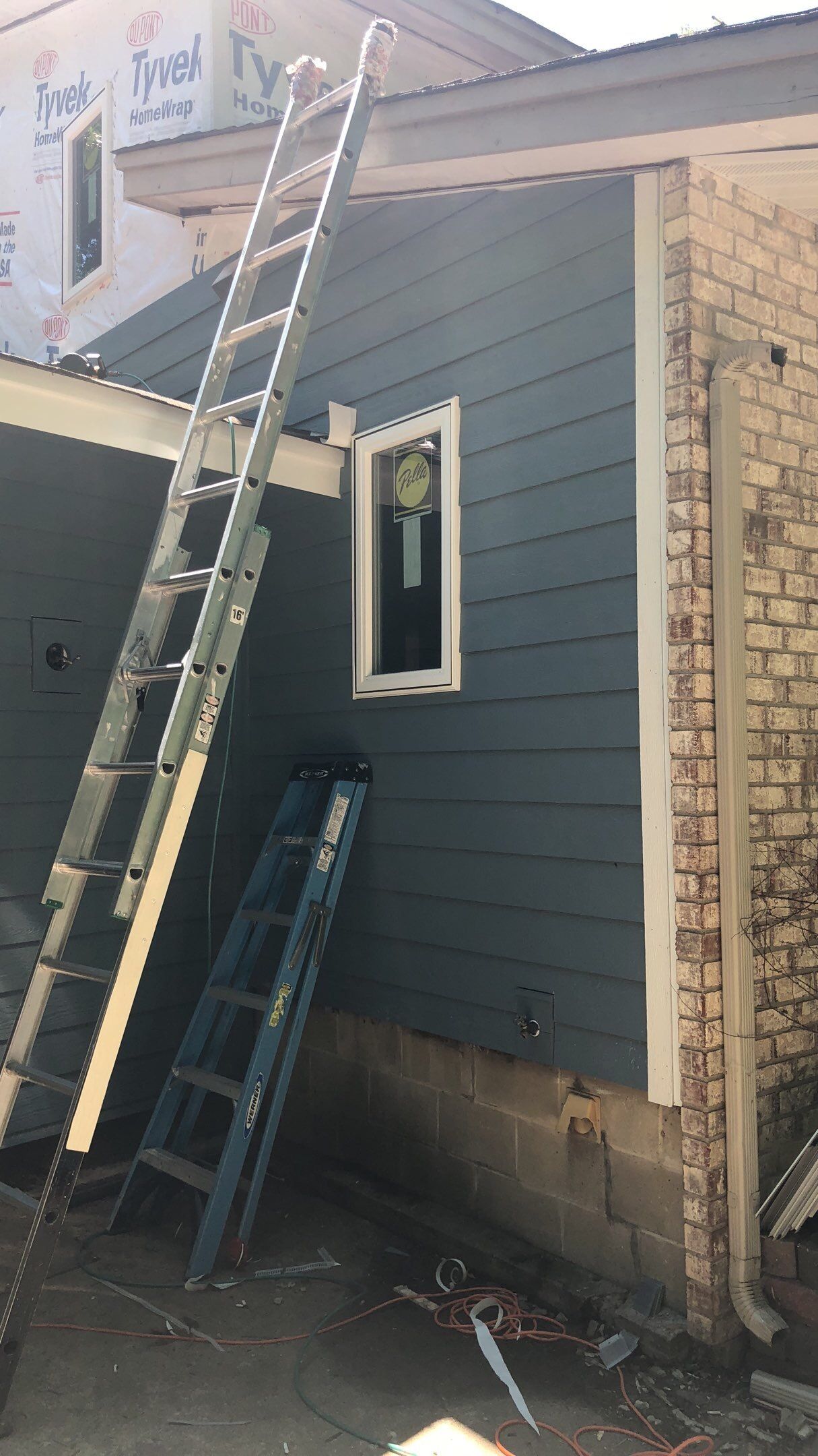 Siding Installation using LP SmartSide and Pella Vinyl Windows by MODERN EXTERIOR SYSTEMS