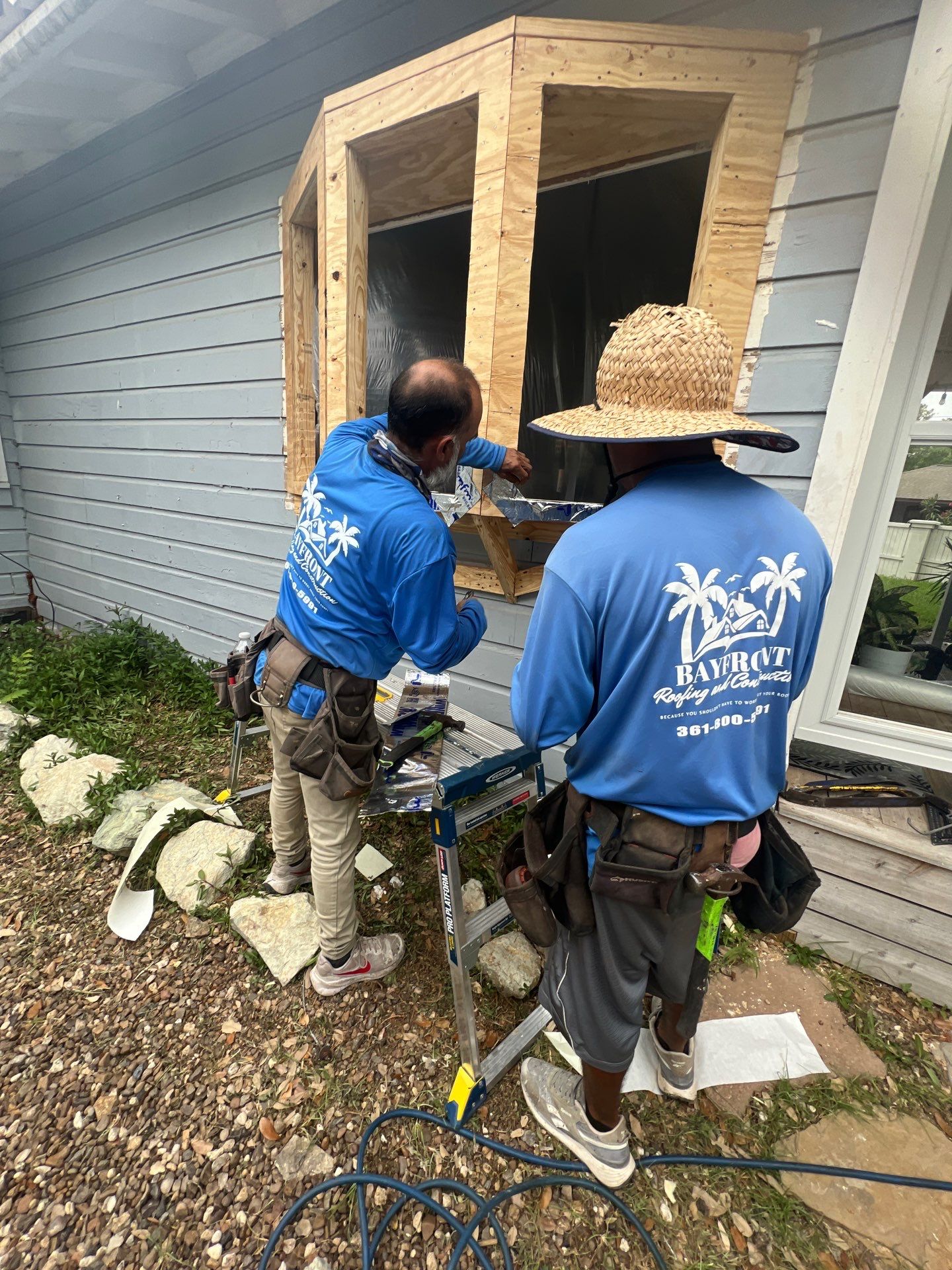 Installing Windows on a Submarine  by Bayfront Roofing and Construction