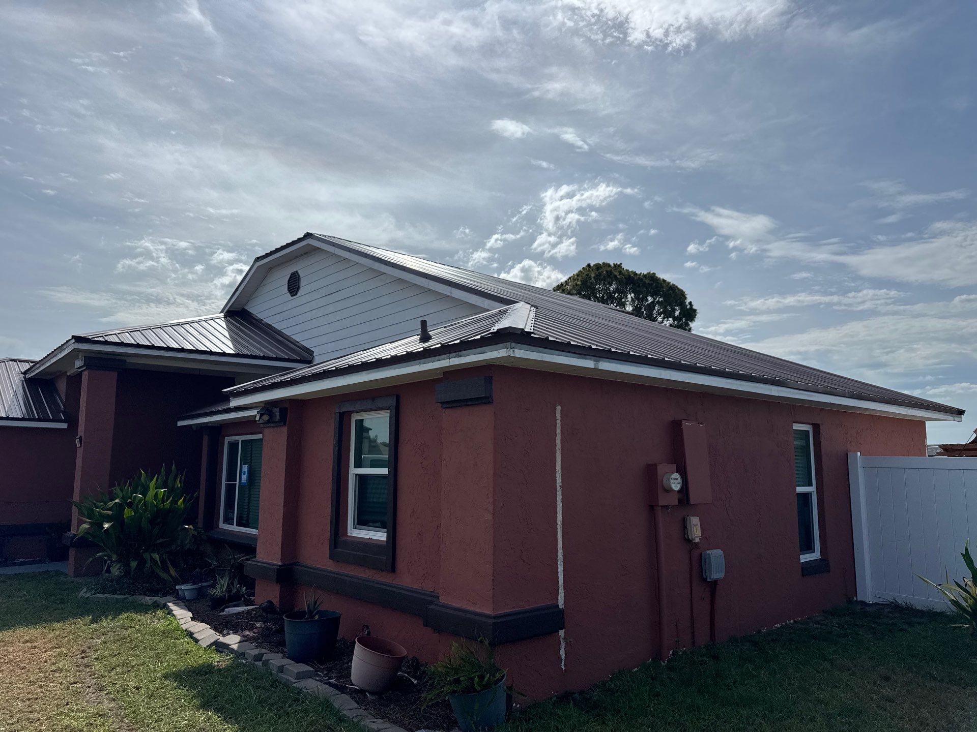 Residential Metal Roofing Installation and Gutter Replacement in Kissimmee by Pinnacle Roofing Group