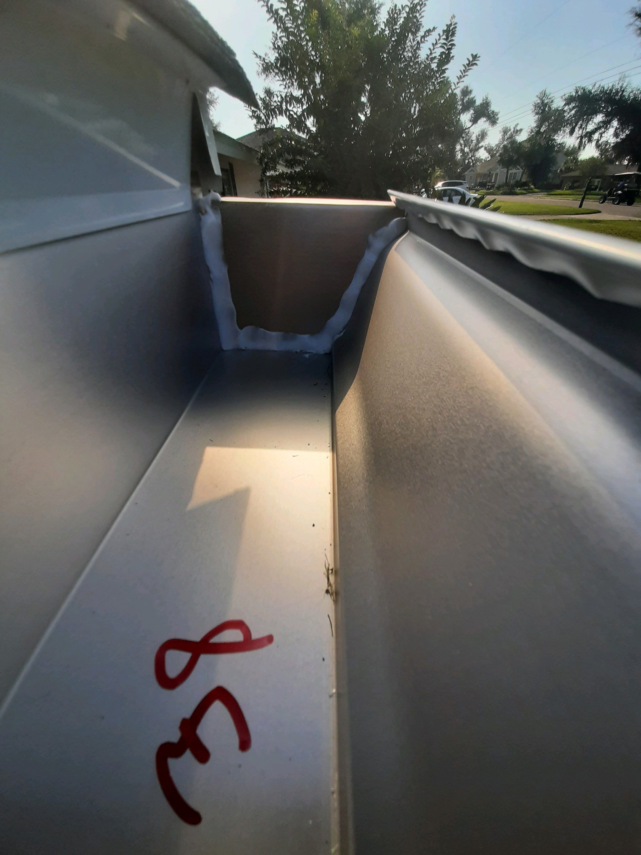 Seamless Gutter Installation using White K-Style Gutters by Gutter Professors