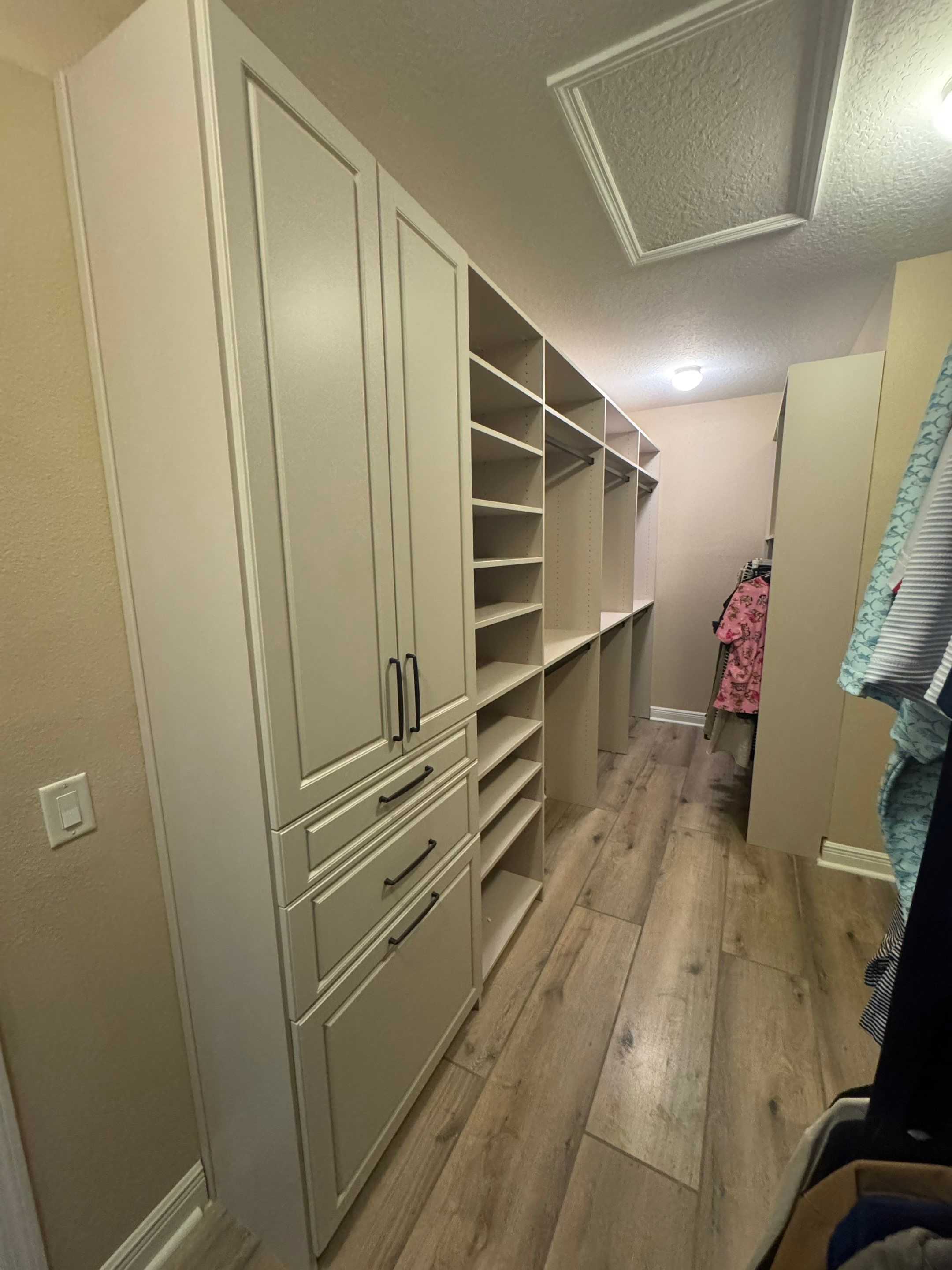 Custom Closet Storage Systems and Laminate Cabinetry Installation in Oldsmar by Square 1 Garage and Closet Solutions