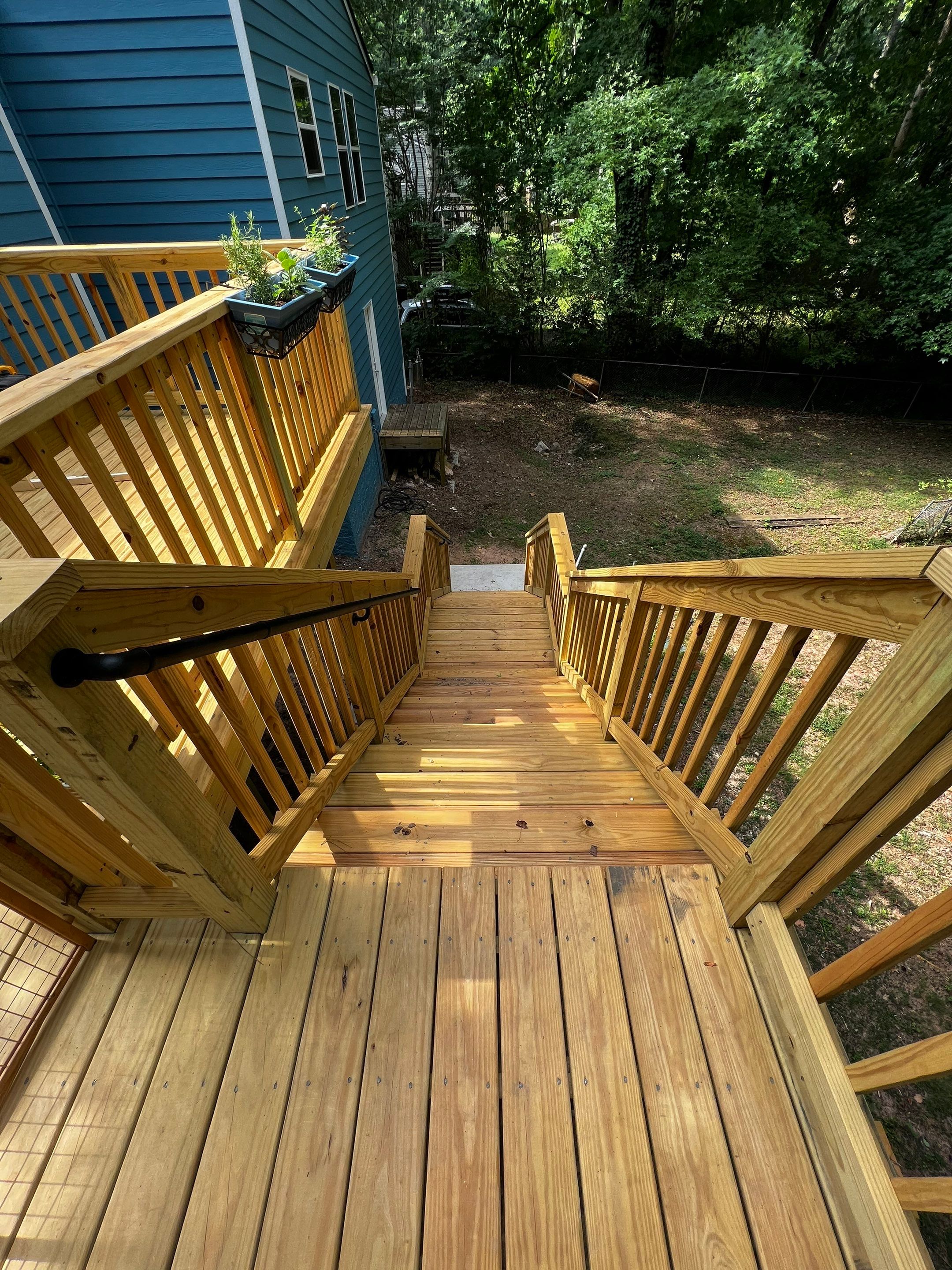 Elevated Wood Deck and Blue Lap Siding Installation in Kennesaw by Swift Home Renovations