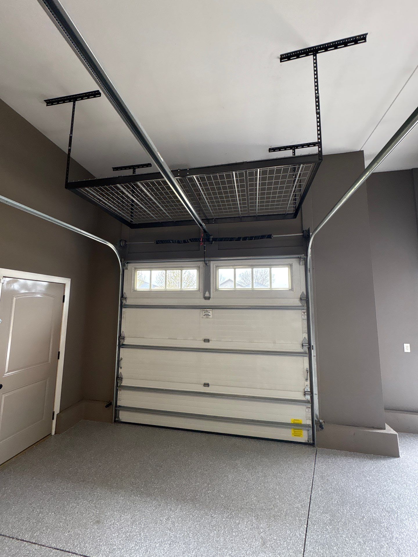 Speckled Grey Epoxy Garage Floor Coating Installation in Tea by Select Painting, Coatings & Garage Cabinets