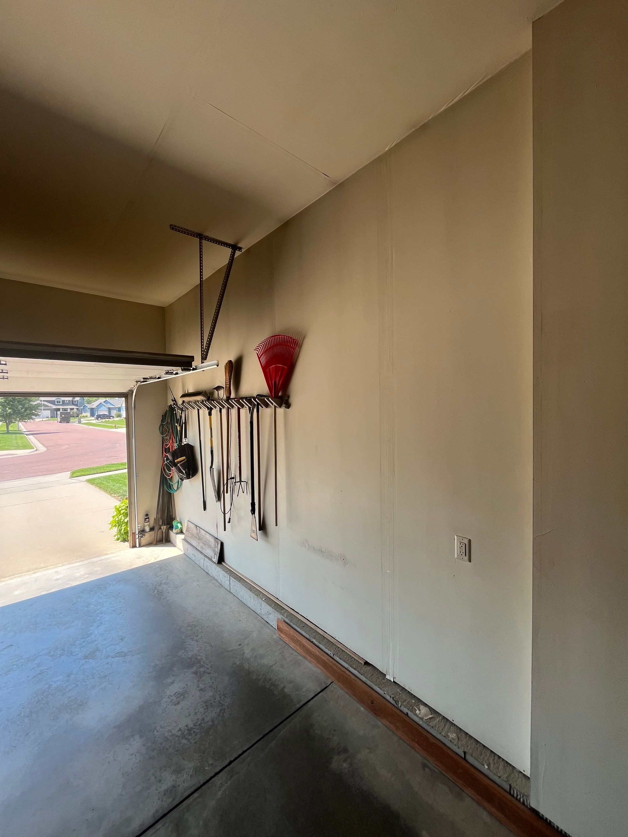 Residential Garage Interior Painting and Drywall Repair in Tea by Select Painting, Coatings & Garage Cabinets