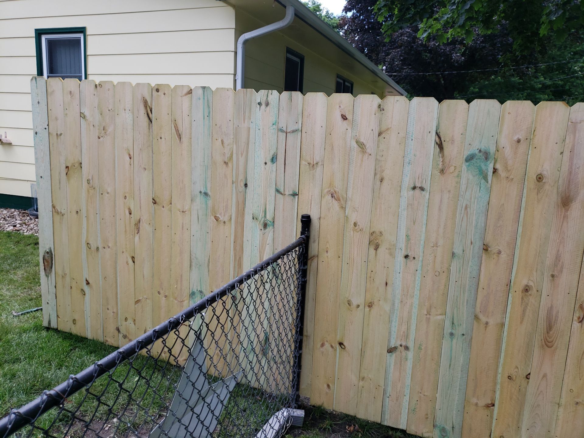 Custom Wood Privacy Fence Installation for Charles City Backyard by Perfect Picket Fence and Stain