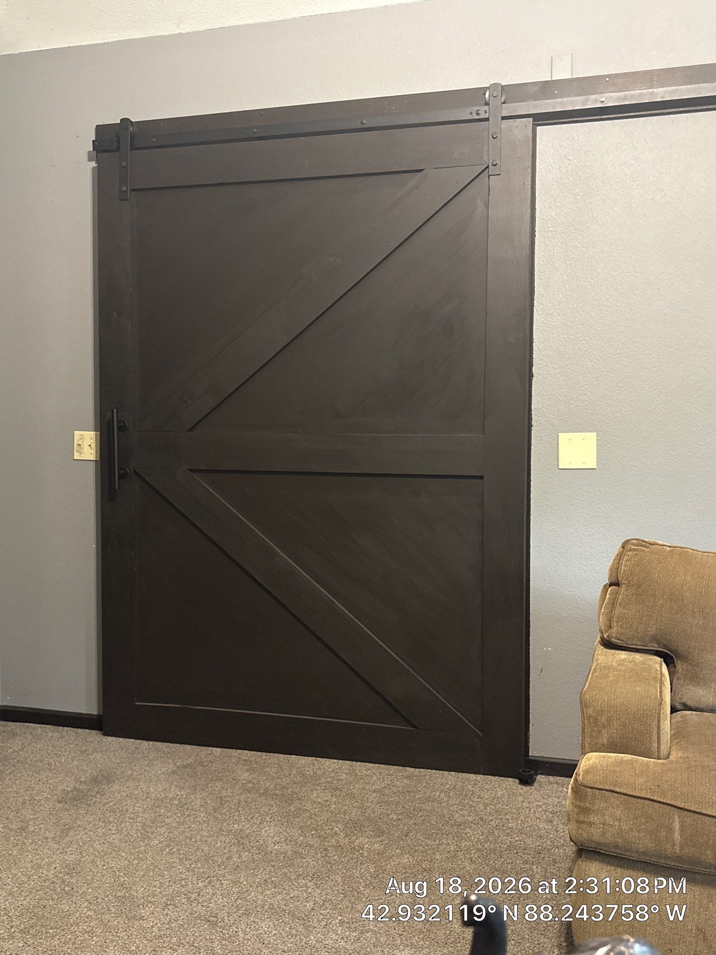 Custom Dark Wood Sliding Barn Door Installation in Waukesha by CompanyCam Sales Demo
