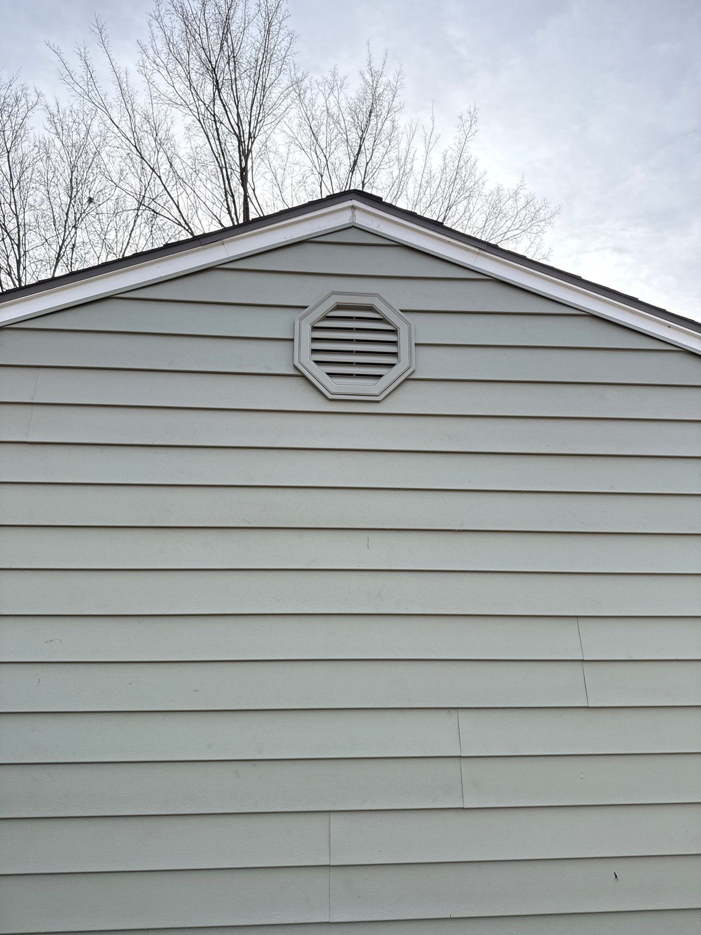 A whole new look for this Gladstone Home  by EEC  Windows, Siding & Roofing 