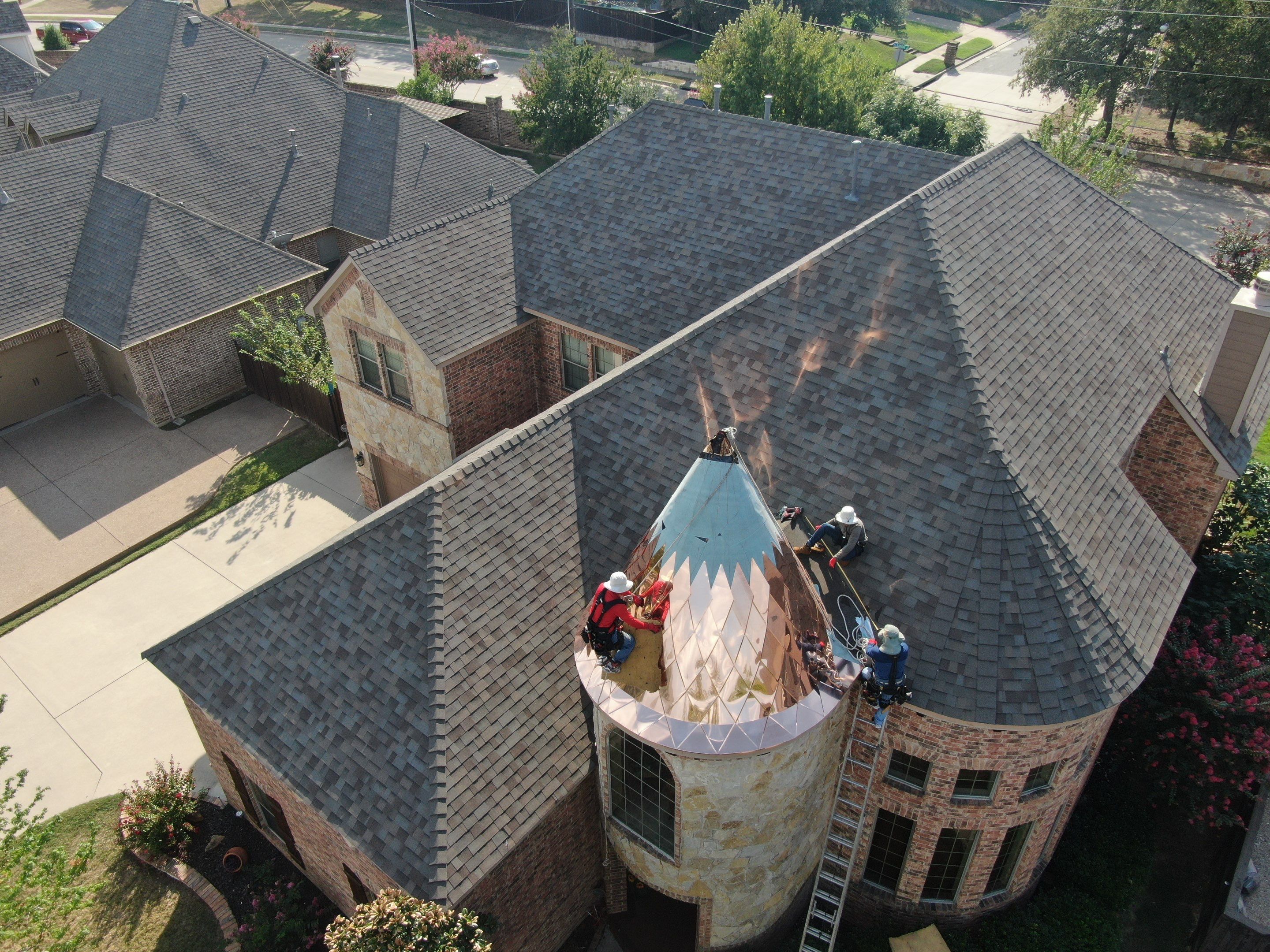 Installing Custom copper turret and Malarkey Vista Class 4 shingles Hail Damage Upgrade by Becker Roofing and Exteriors