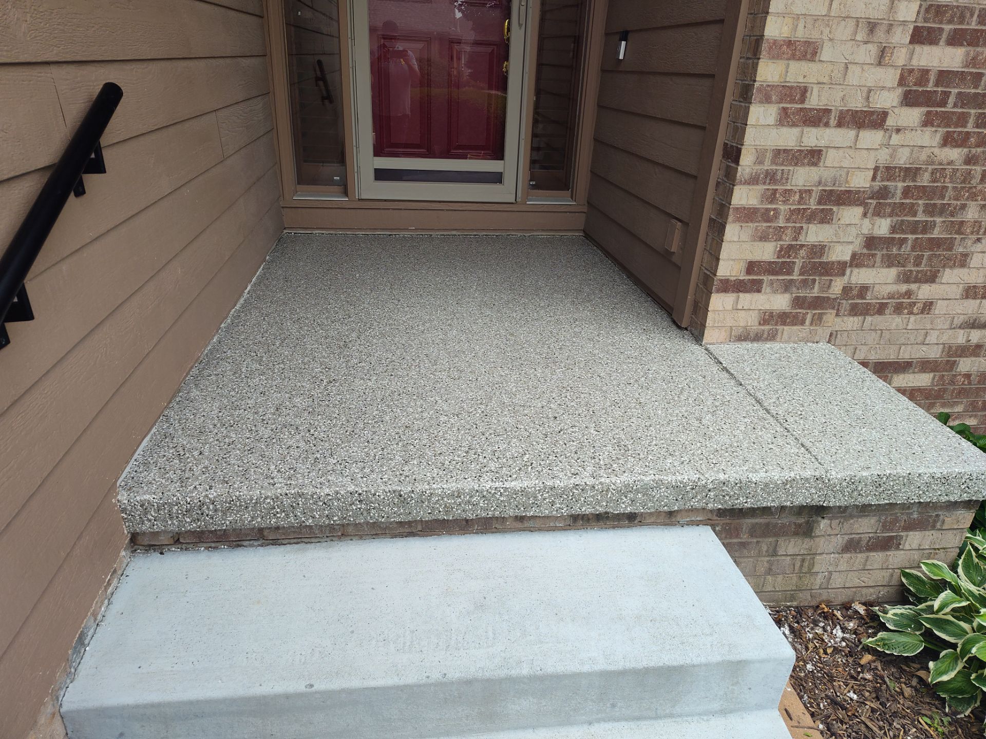Slip Resistant, Durable, and Aesthetically-Pleasing Front Porch in Omaha  by Revival Concrete Coatings