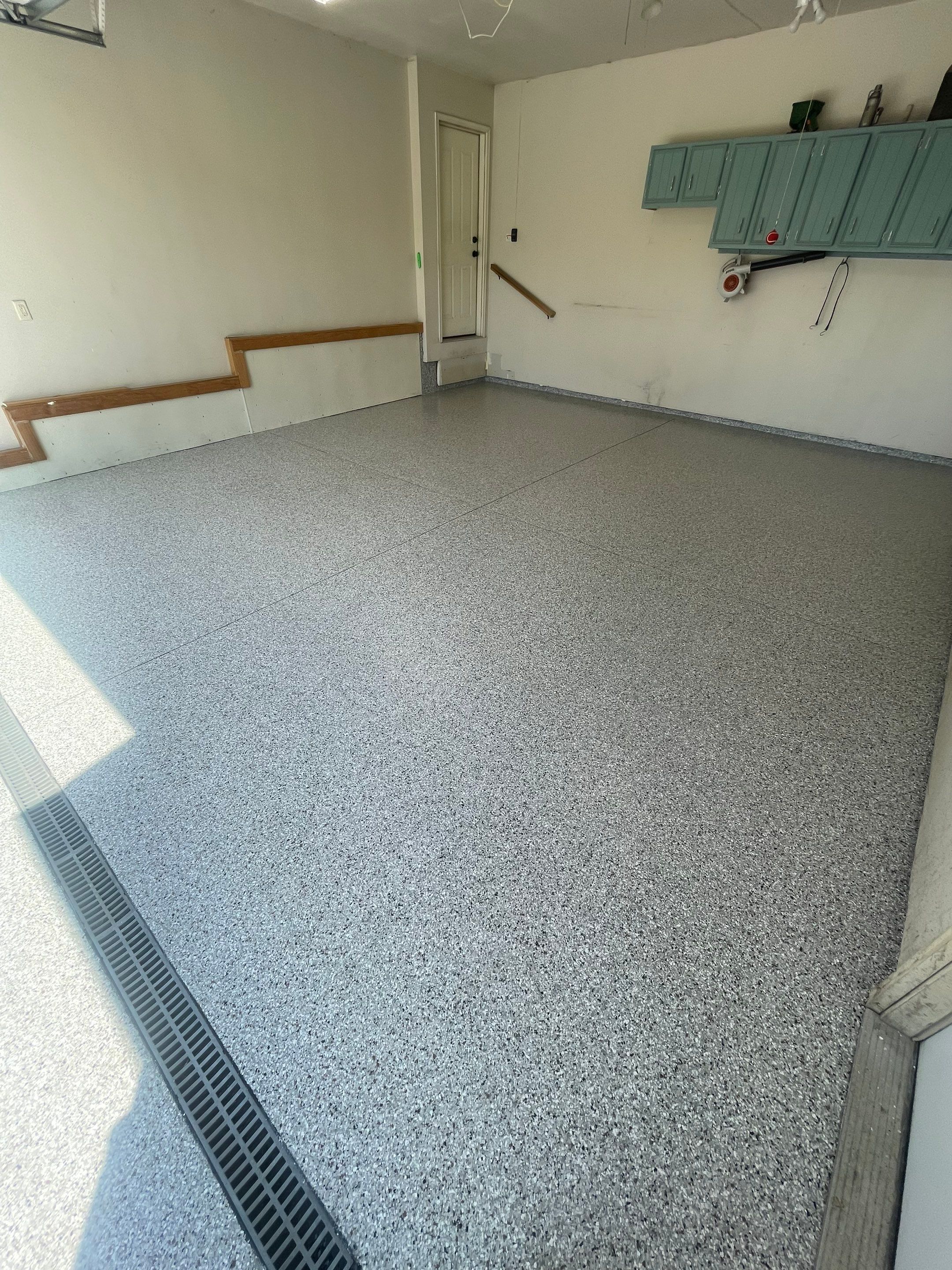 Multi-Stall Garage Floor Coating Installation in Sioux Falls by Select Painting, Coatings & Garage Cabinets