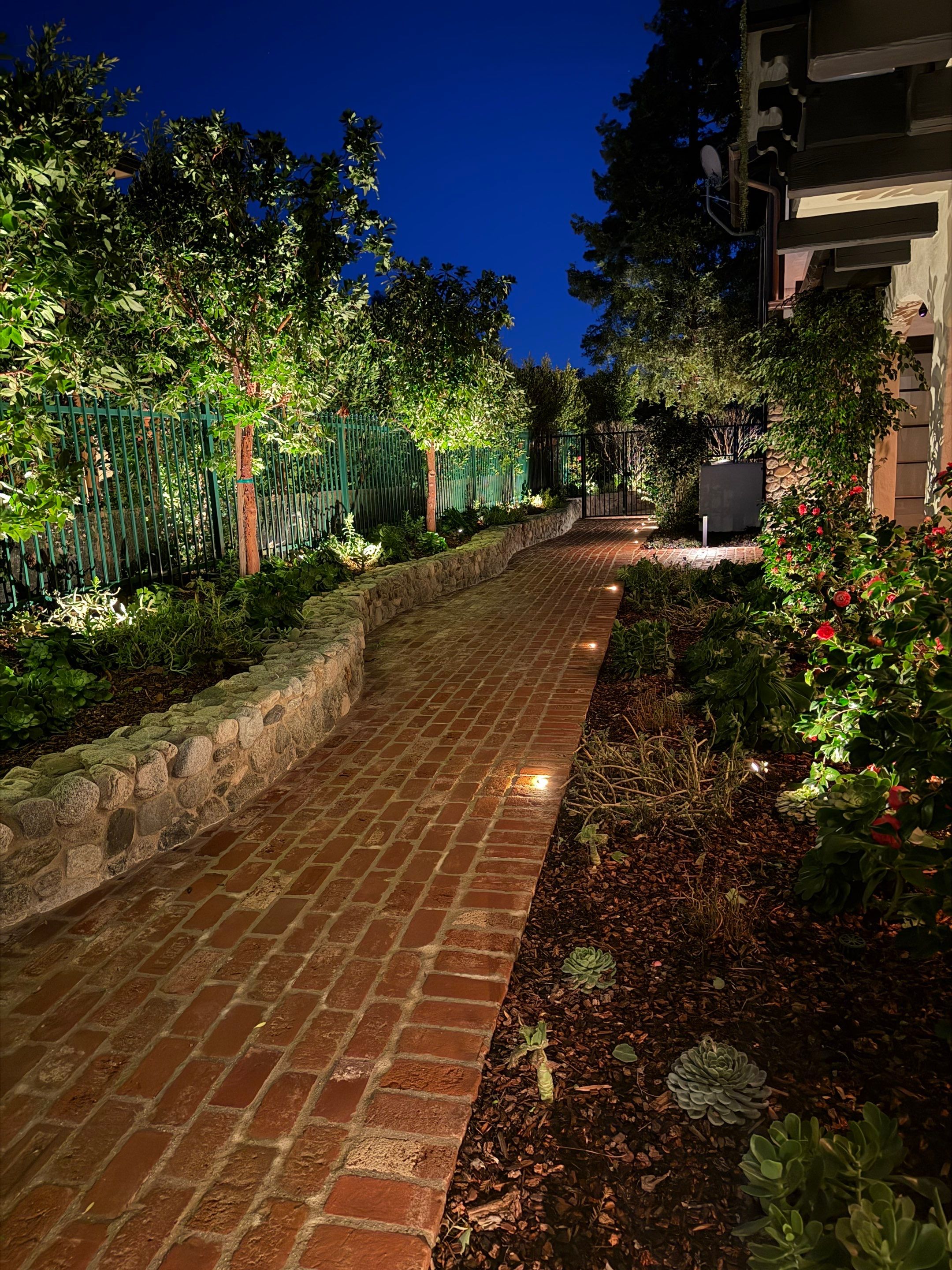 Tudor Estate Landscape Lighting with Integrated Stone Step Illumination by Outdoor Lights + Shades