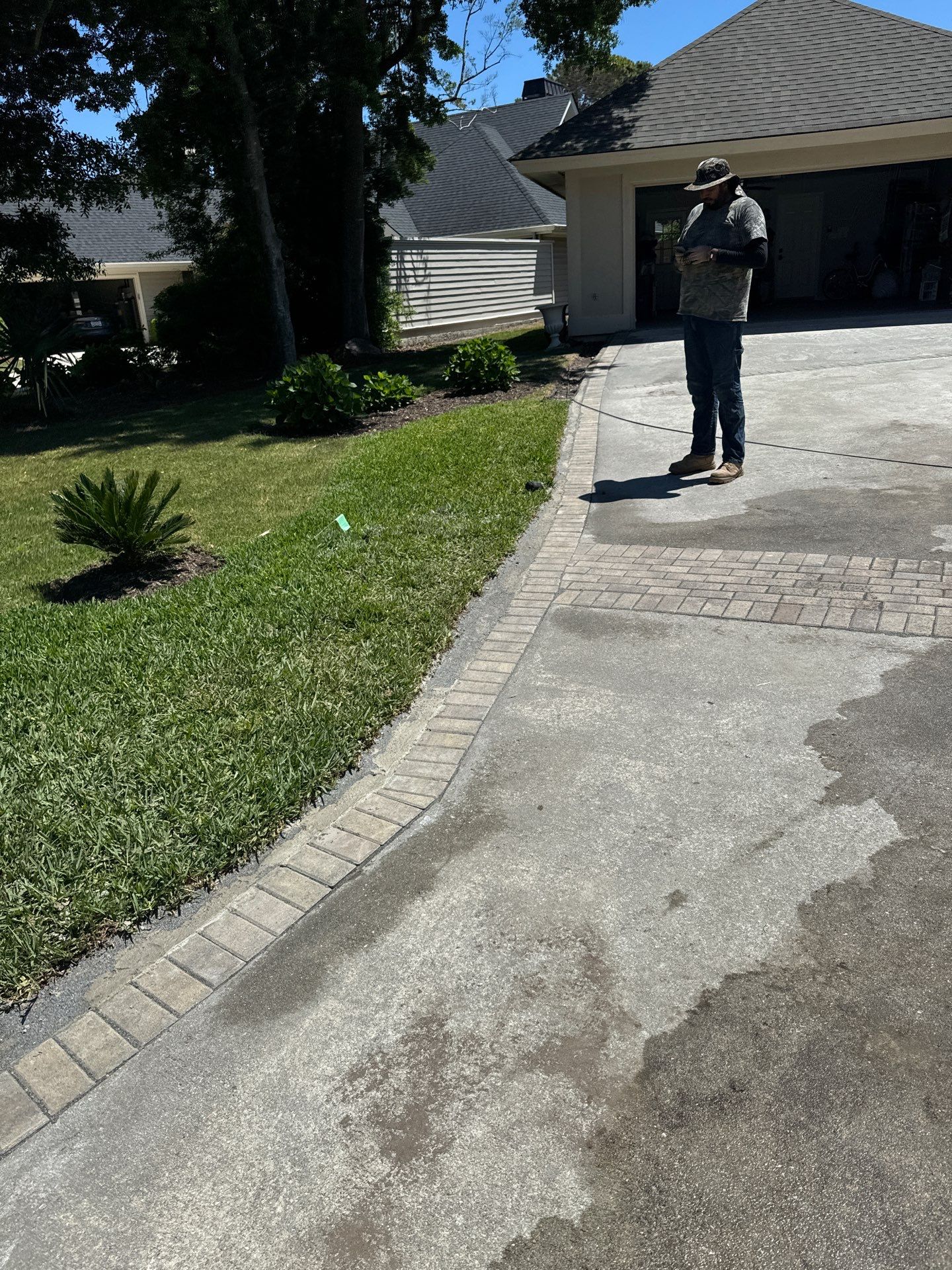 Concrete Driveway Repair with Decorative Paver Accents in Hilton Head Island by Lowcountry Scapes, LLC