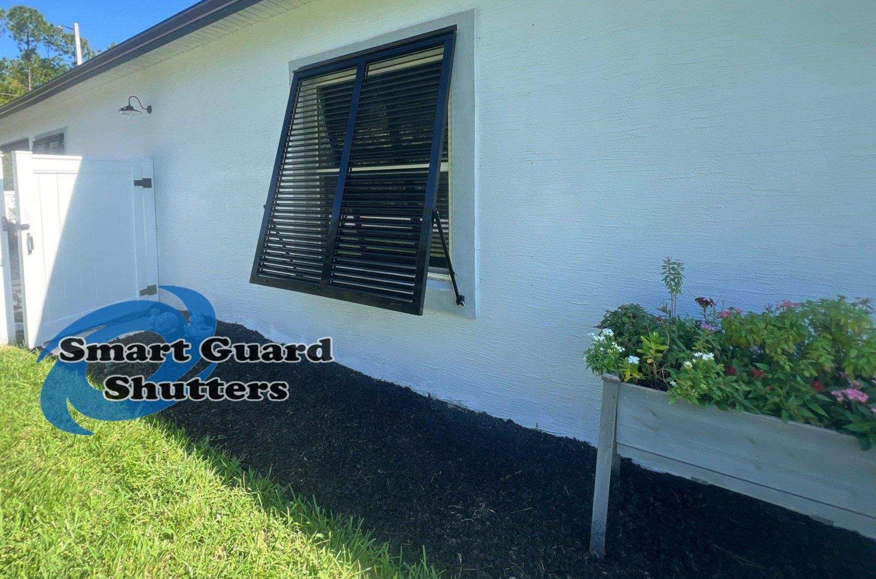 Impact Bahama Shutters in Jet Black by Smart Guard Shutters