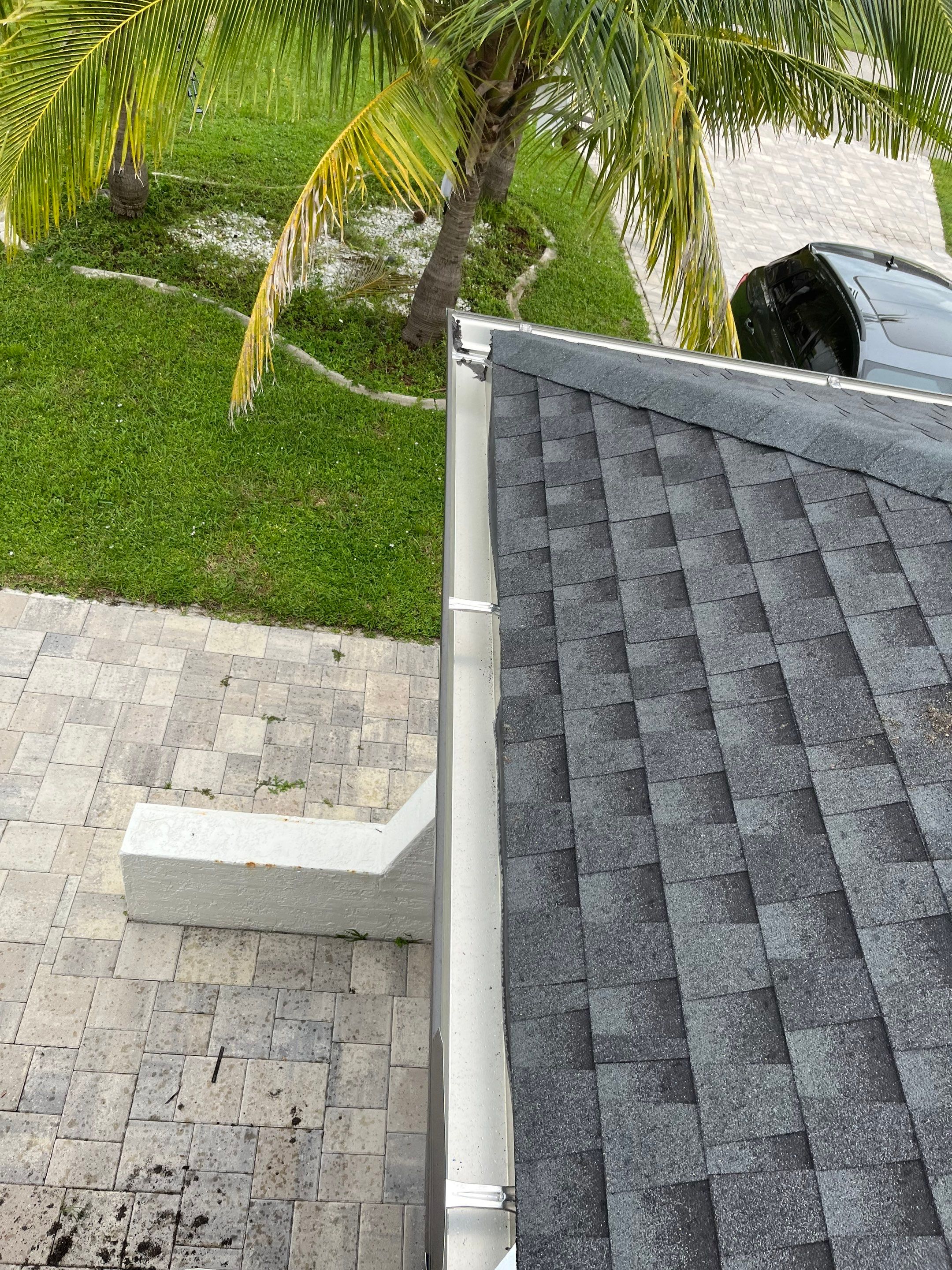 Black Seamless Gutters for a Modern Look in Cape Coral FL by Gutter Professors