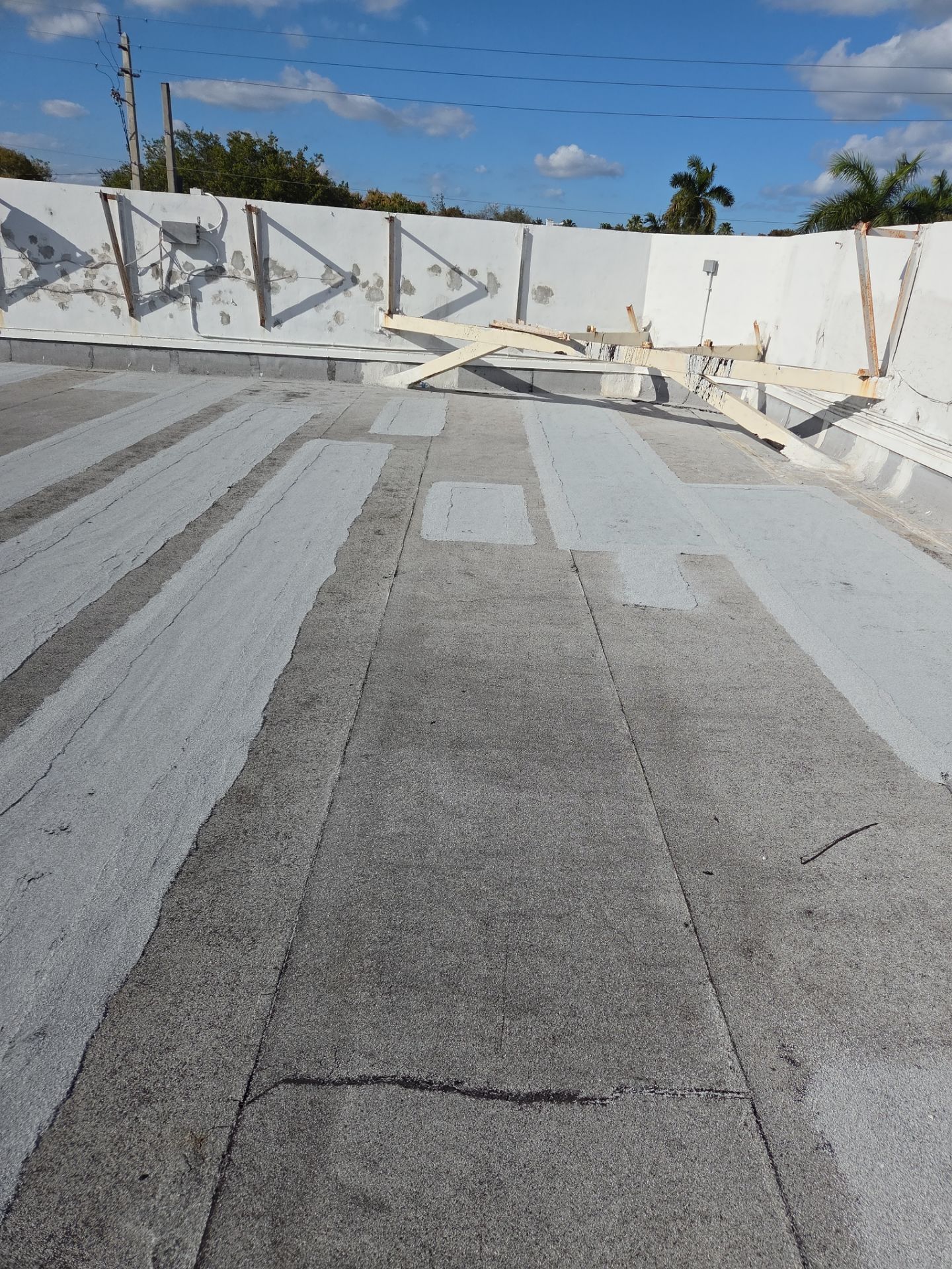 Commercial Flat Roof Restoration Using Silicone Coating in Hallandale Beach by Aastro Roofing
