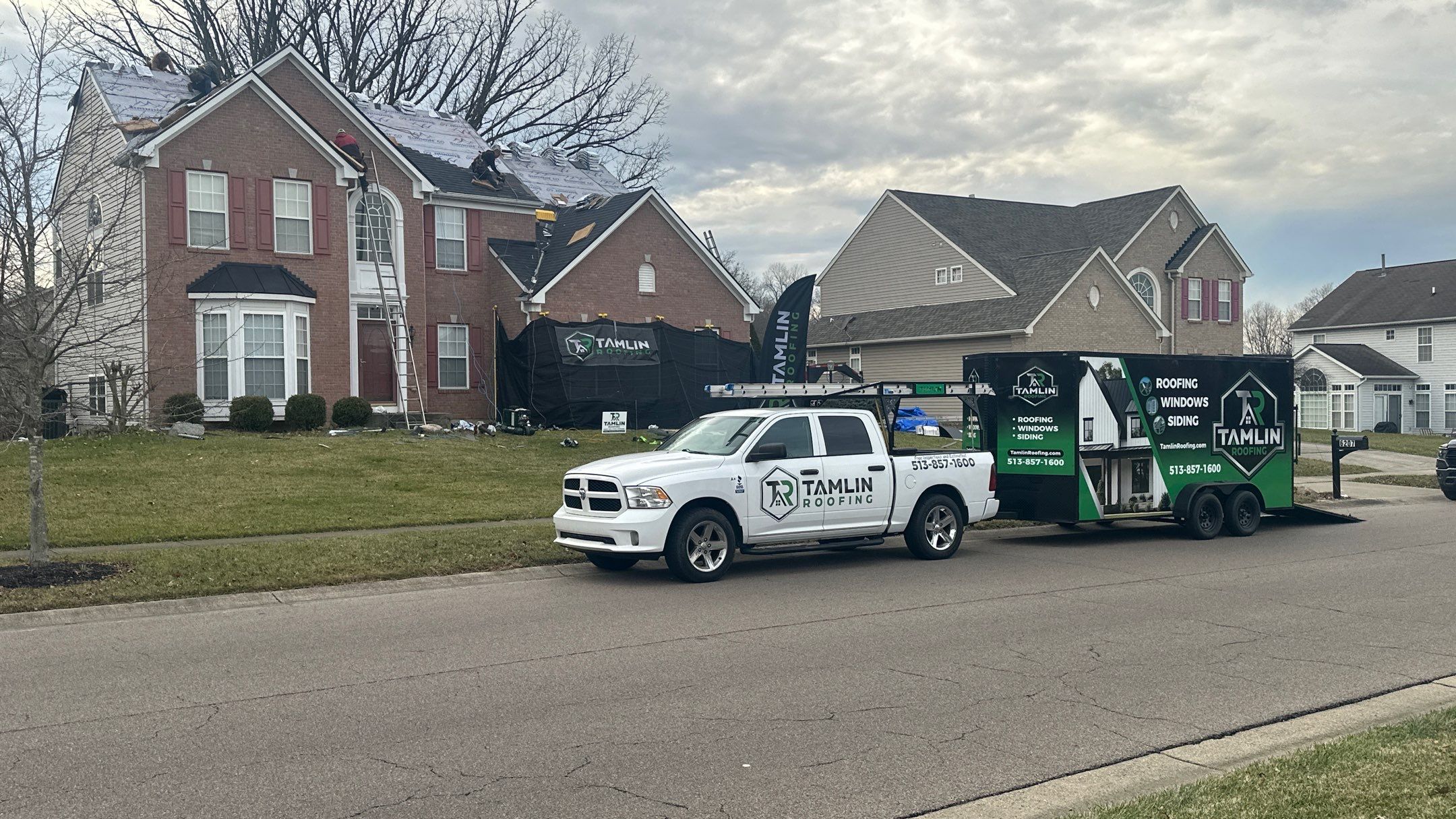 Walden Ponds - Pristine Black and Hydro Flo Gutter Guards by Tamlin Roofing