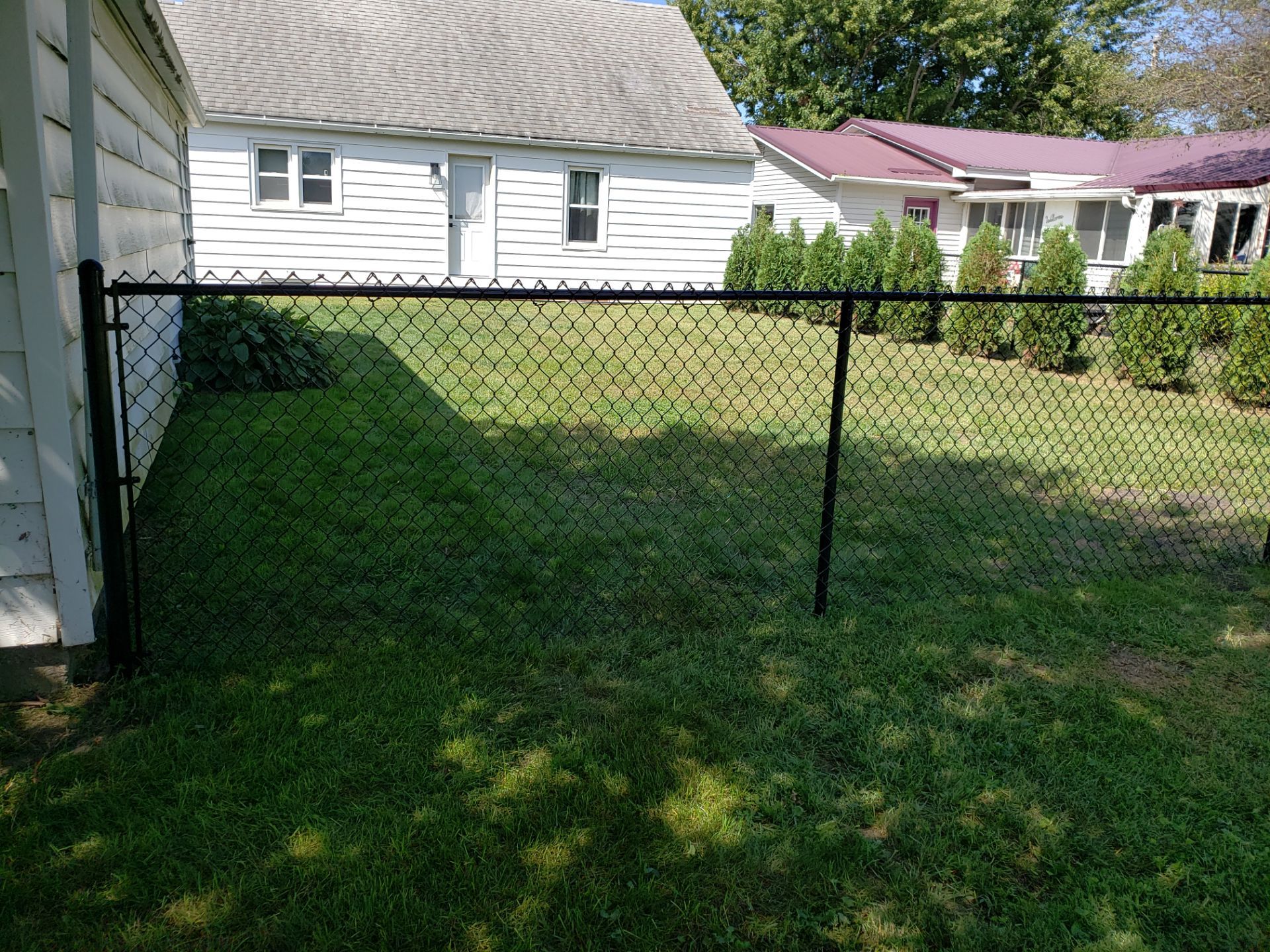 Residential Black Chain Link Fencing Project in Wellburg, Iowa by Perfect Picket Fence and Stain