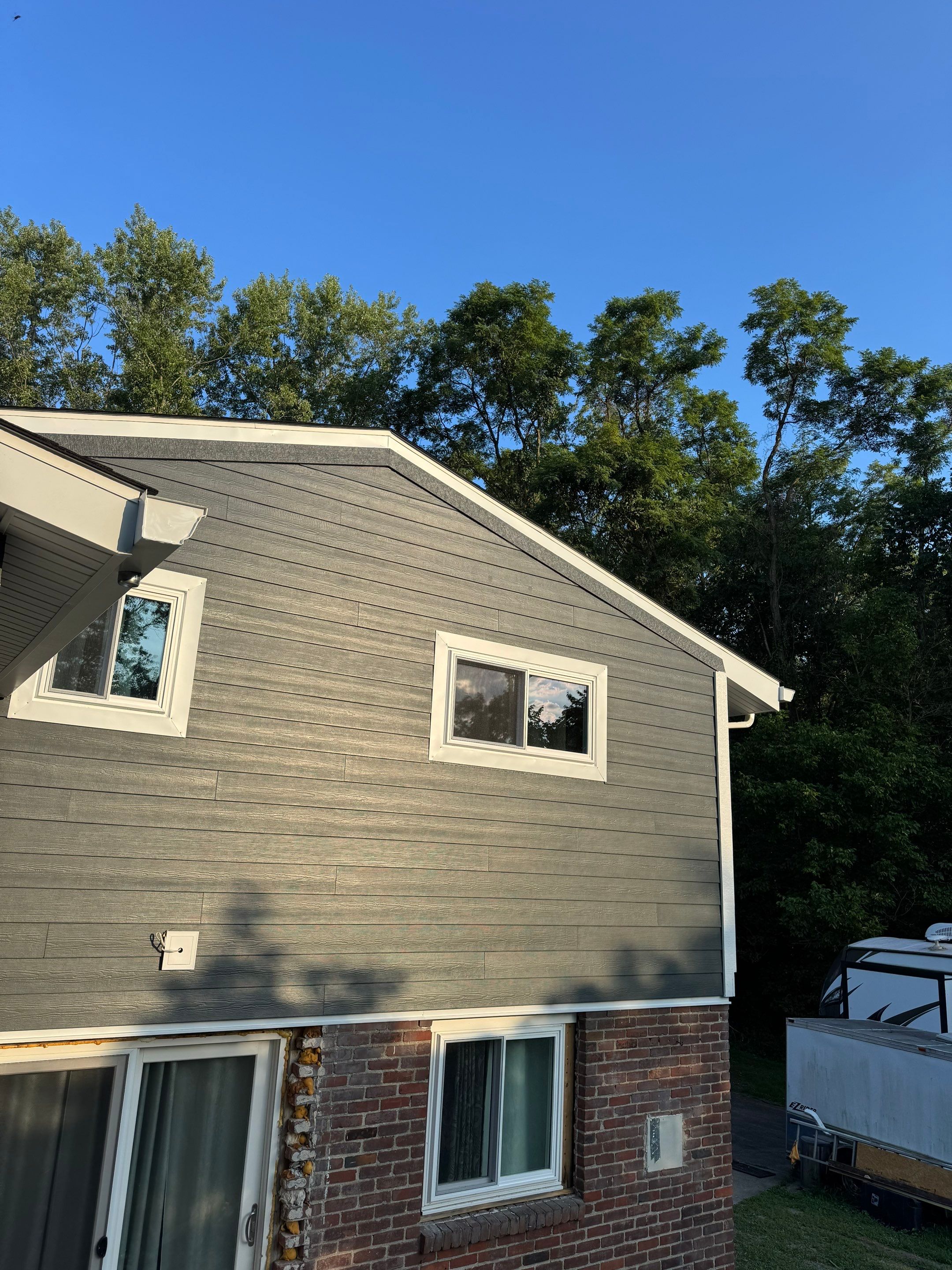 Hardie Siding and Window Project in Bridgeville by Cousins Roofing Siding & Decks
