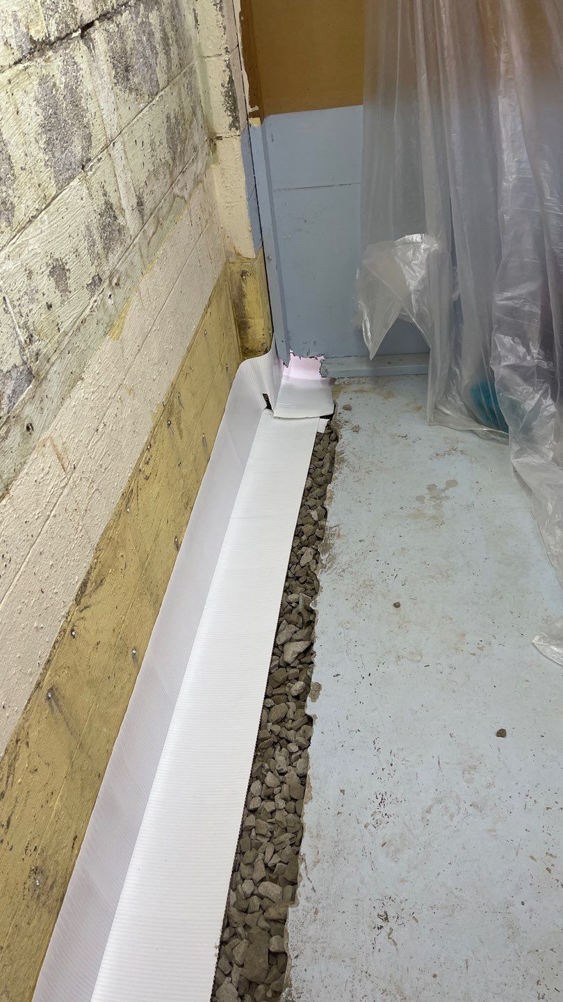 Interior Waterproofing Using GrateDrain™ Products by Toledo Basement Repair 